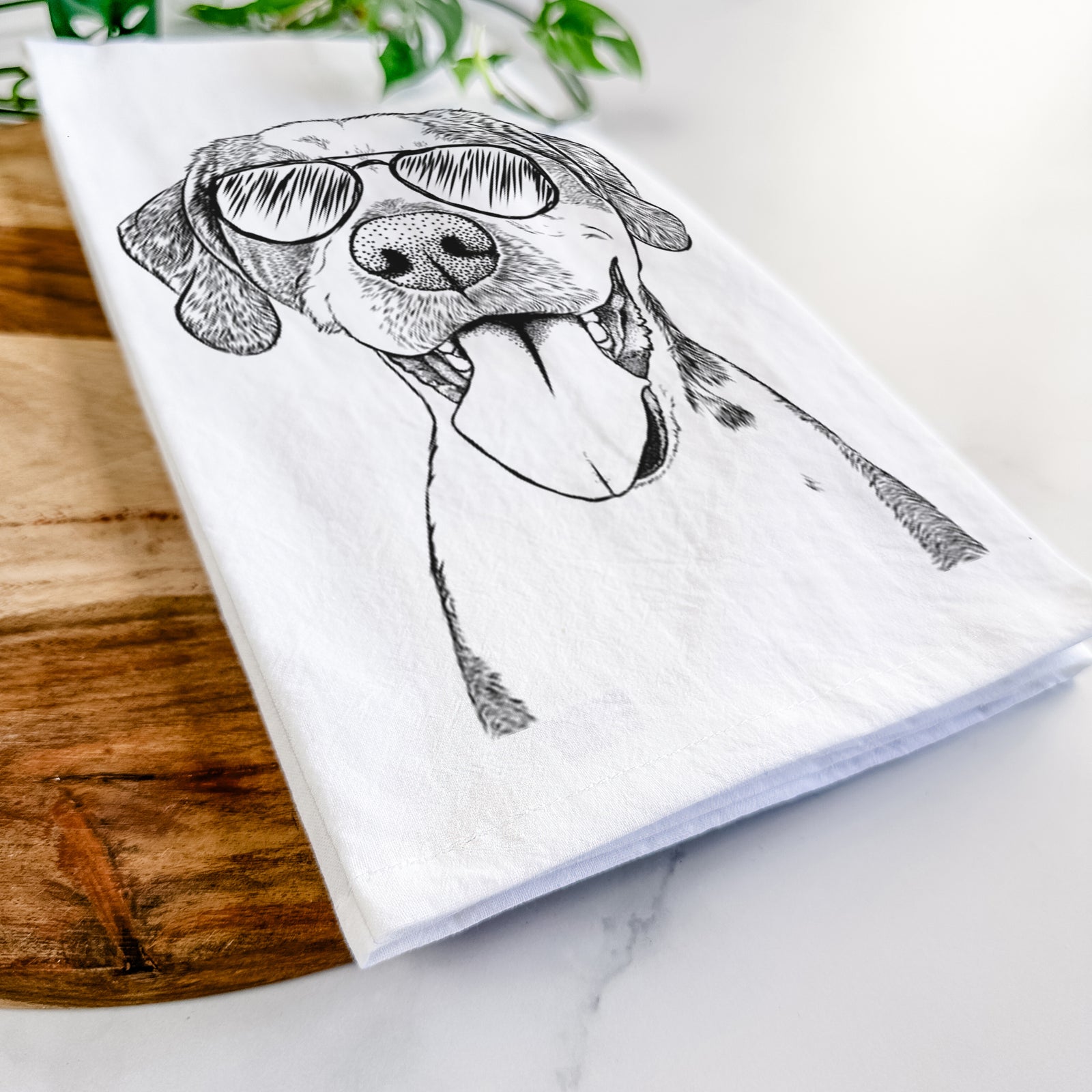 Hand-drawn sketch of Ace Boogie the Mixed Breed wearing aviator sunglasses on a tea towel