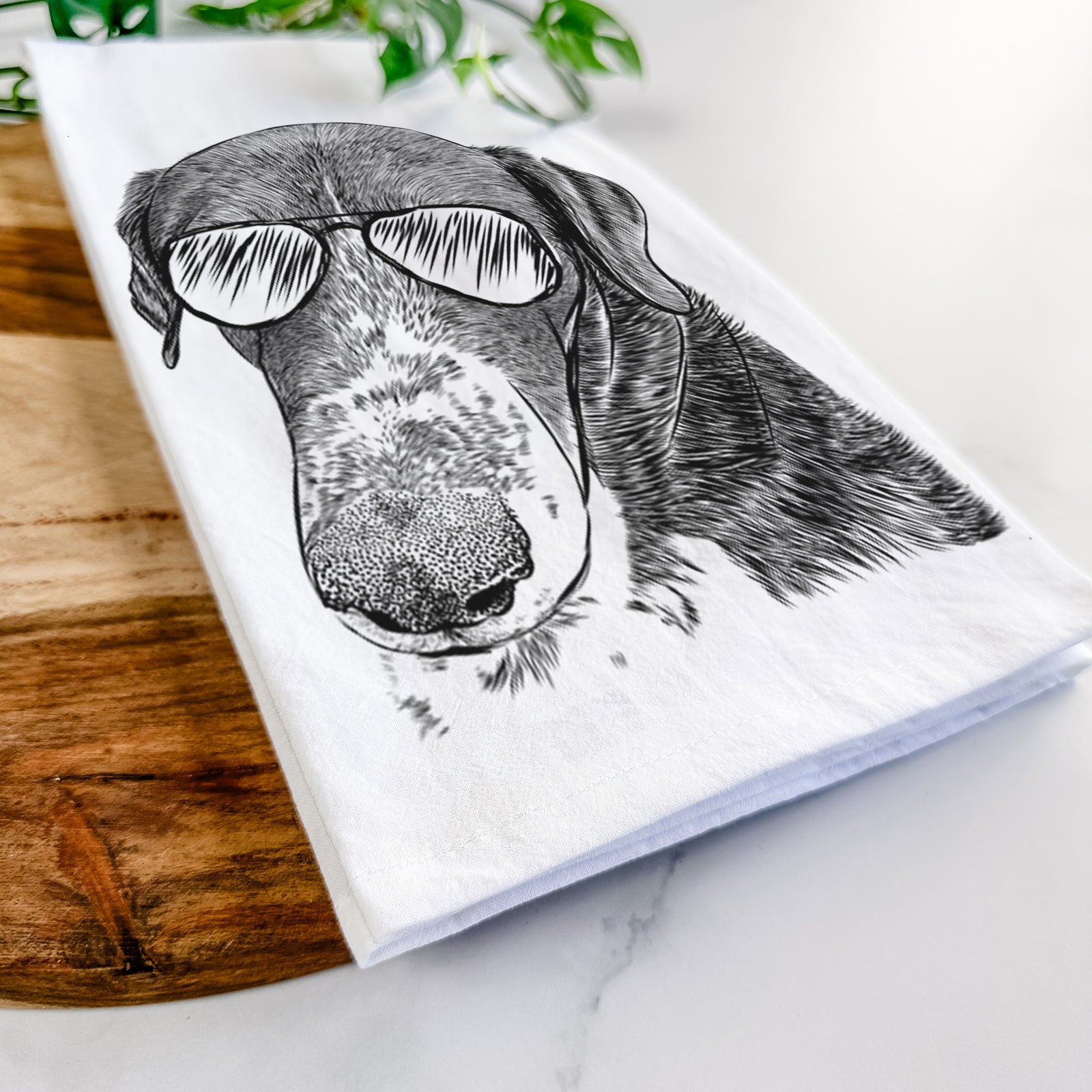 Hand-drawn sketch of Angel Orion the Mixed Breed wearing aviator sunglasses on a tea towel