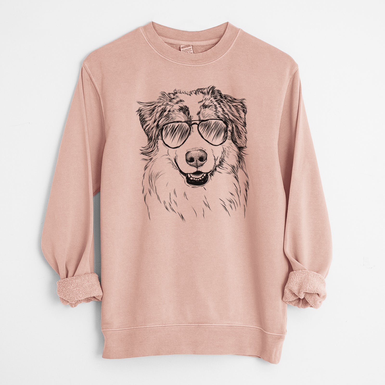 Hand-drawn sketch of Aonghus the Australian Shepherd wearing aviator sunglasses on a Dusty Pink Unisex pigment dyed crew sweatshirt