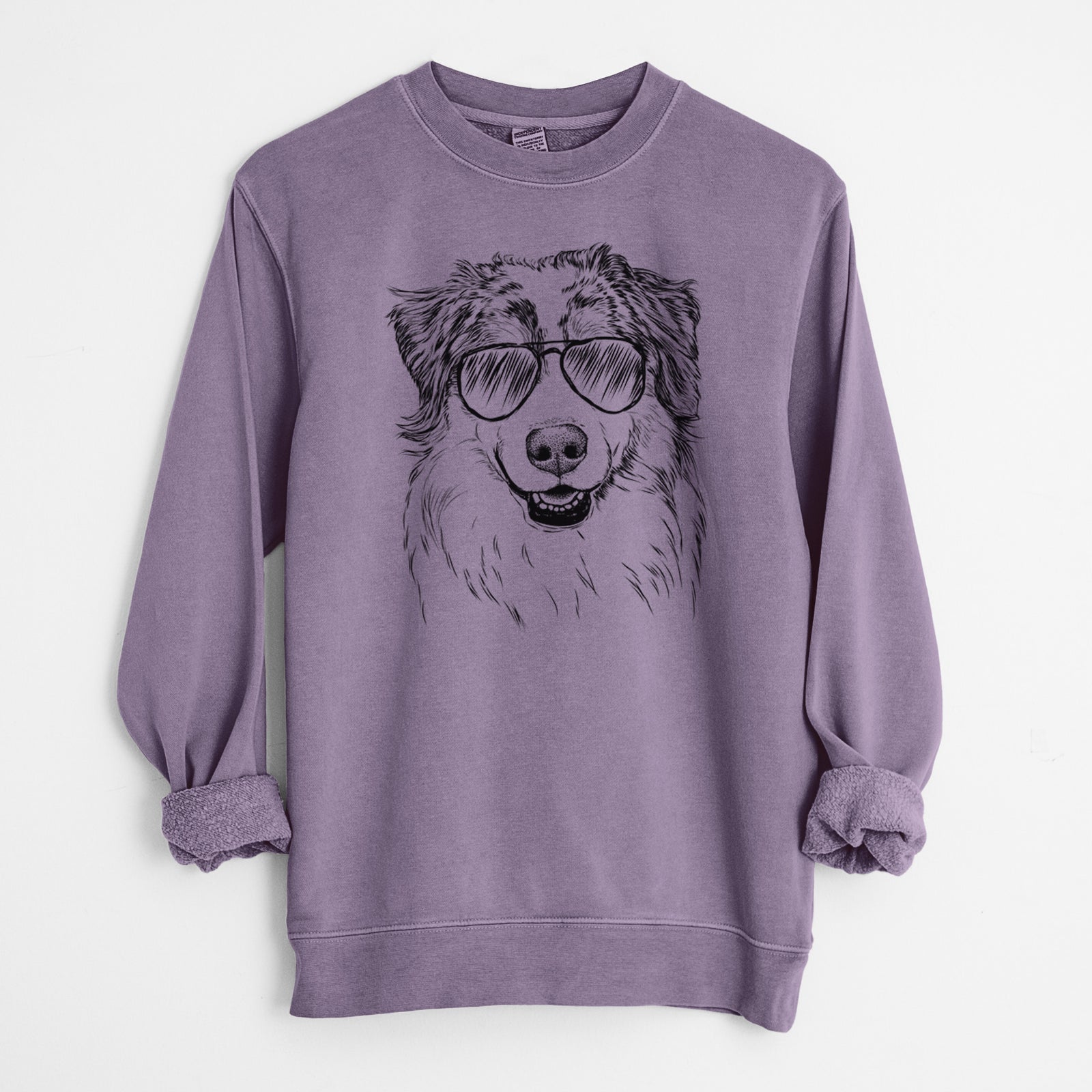 Hand-drawn sketch of Aonghus the Australian Shepherd wearing aviator sunglasses on a Plum Unisex pigment dyed crew sweatshirt