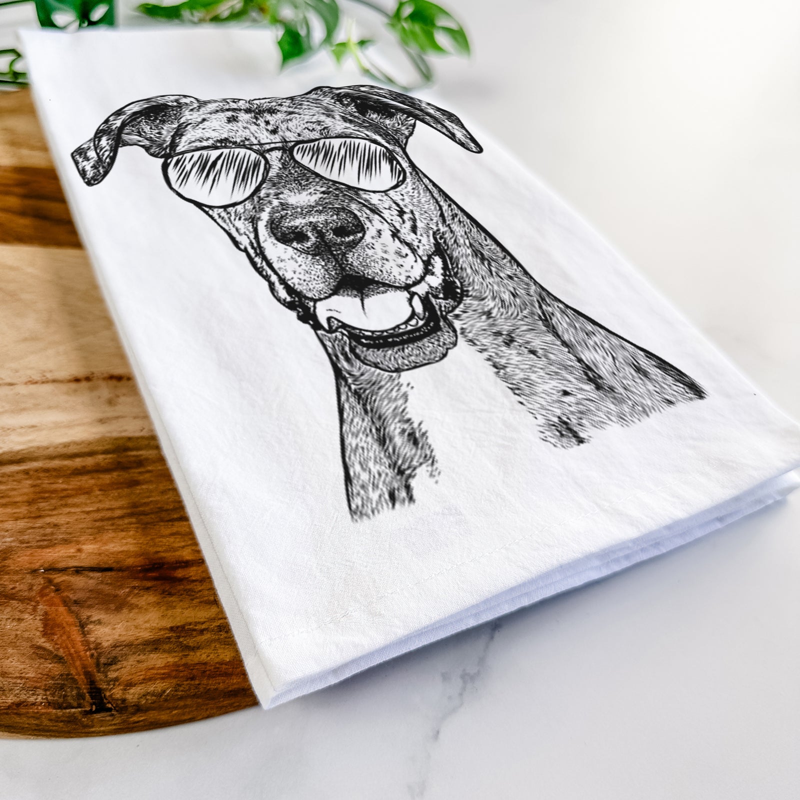 Hand-drawn sketch of Athena the Merle Great Dane wearing aviator sunglasses on a tea towel