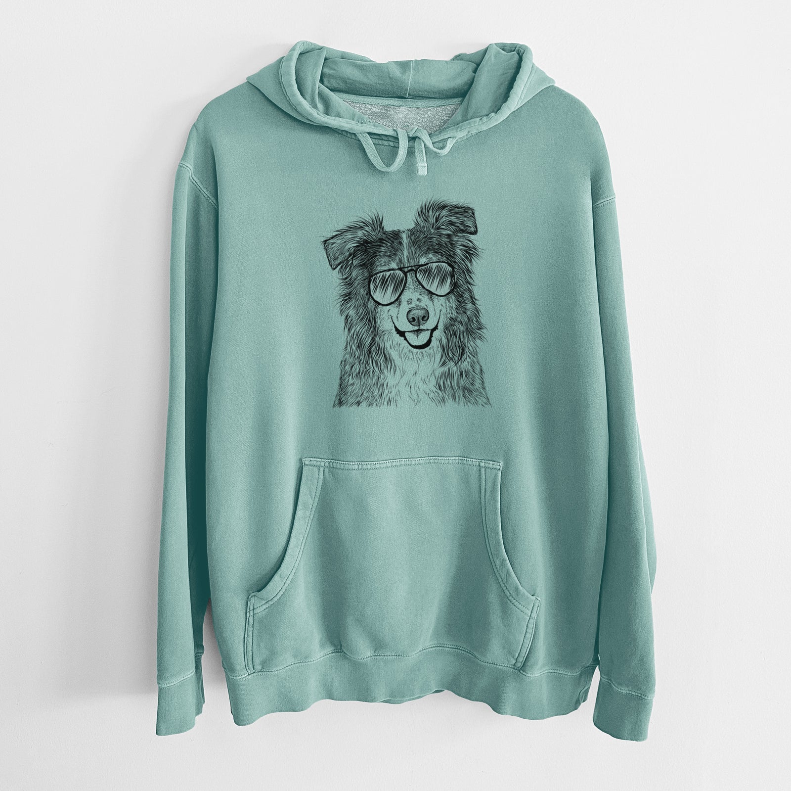 Hand-drawn sketch of Aushe the Australian Shepherd wearing aviator sunglasses on a Mint Unisex pigment dyed hoodie
