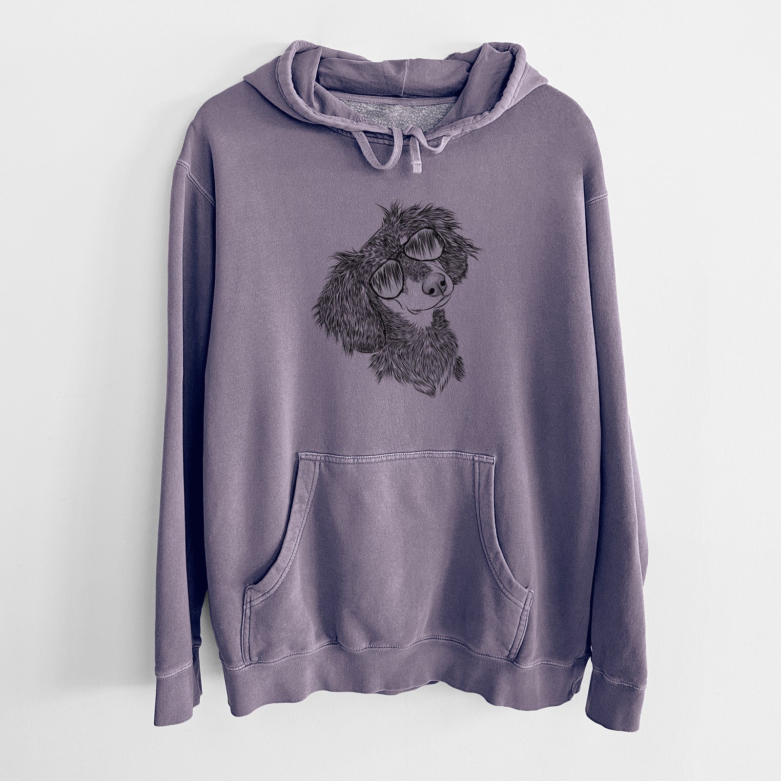 Hand-drawn sketch of Bailey the Long Haired Dachshund wearing aviator sunglasses on a Plum Unisex pigment dyed hoodie