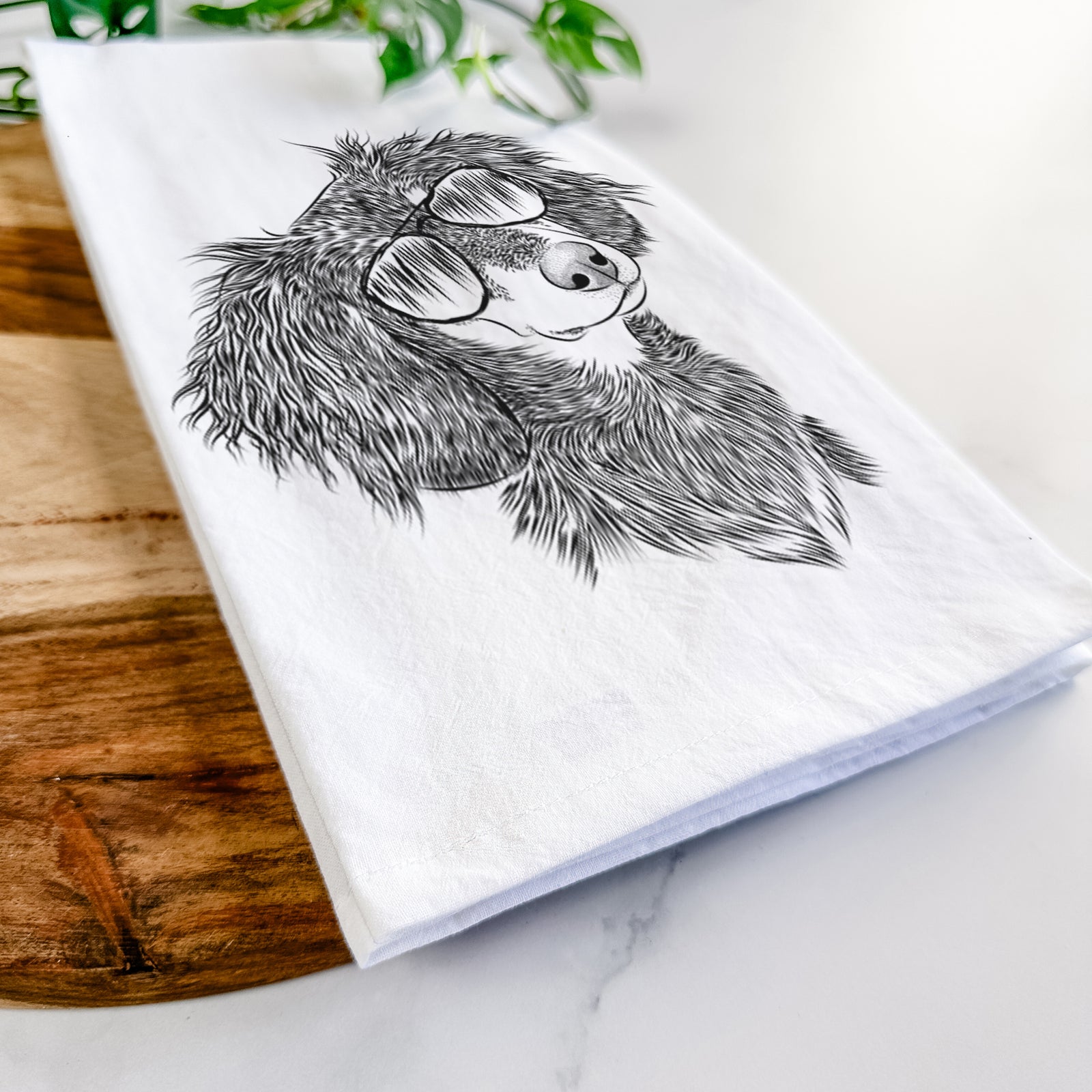 Hand-drawn sketch of Bailey the Long Haired Dachshund wearing aviator sunglasses on a tea towel