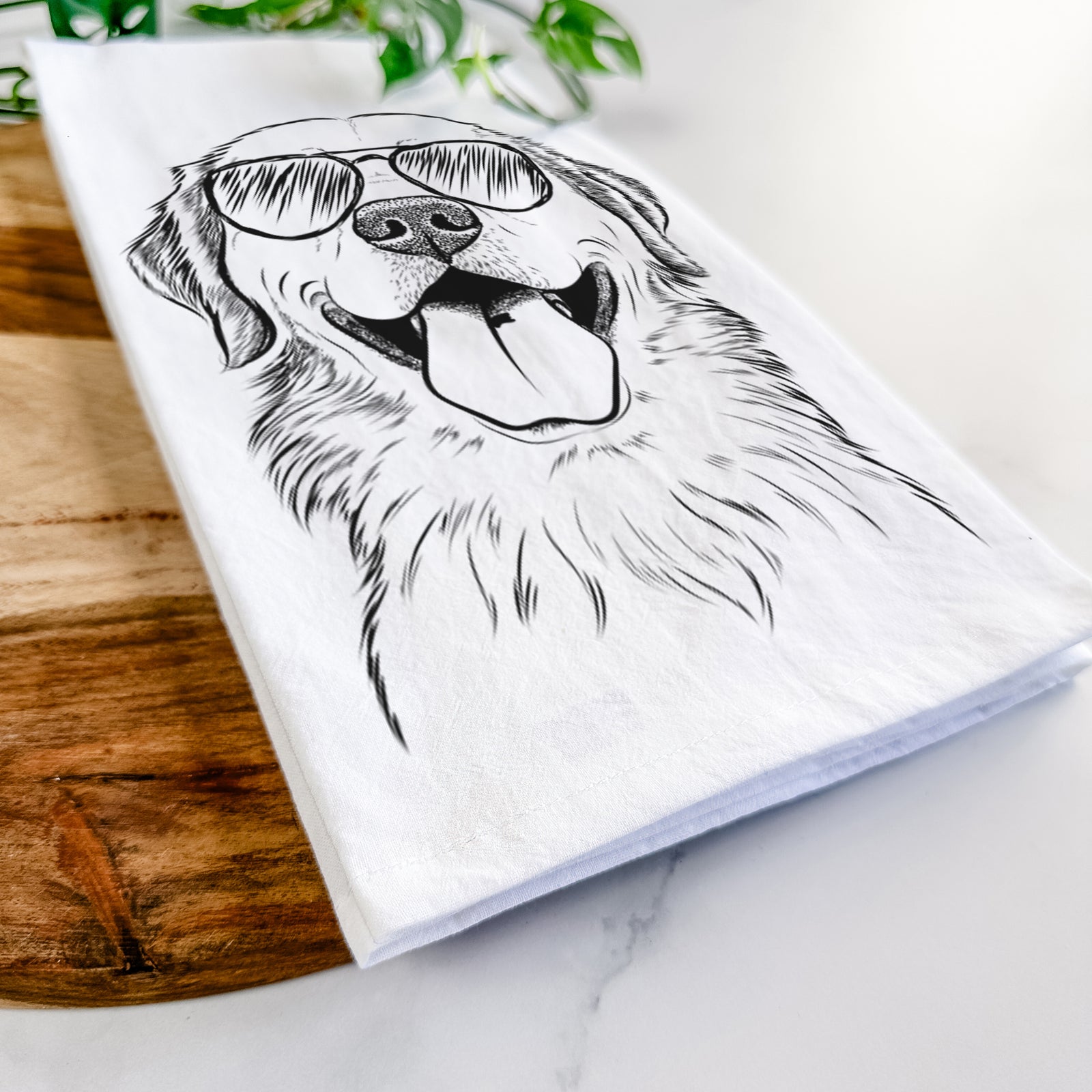 Hand-drawn sketch of Bennett the Golden Retriever wearing aviator sunglasses on a tea towel