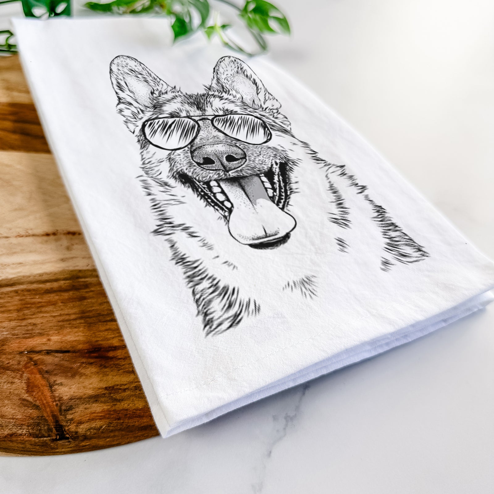 Hand-drawn sketch of Benson the German Shepherd wearing aviator sunglasses on a tea towel