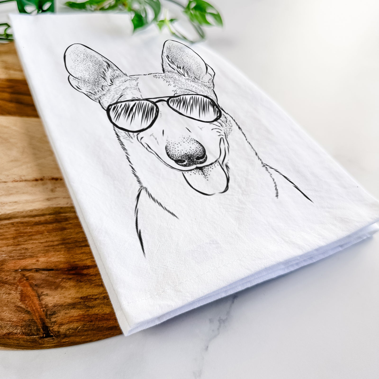 Hand-drawn sketch of Berlin the Carolina Dog wearing aviator sunglasses on a tea towel