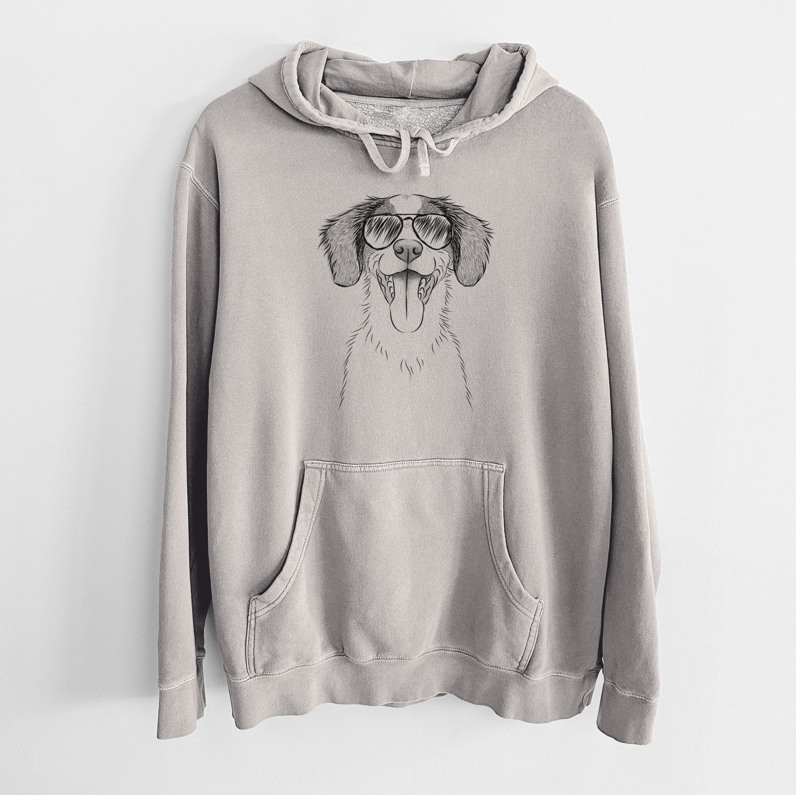 Hand-drawn sketch of Birdie the Brittany wearing aviator sunglasses on a Cement Unisex pigment dyed hoodie