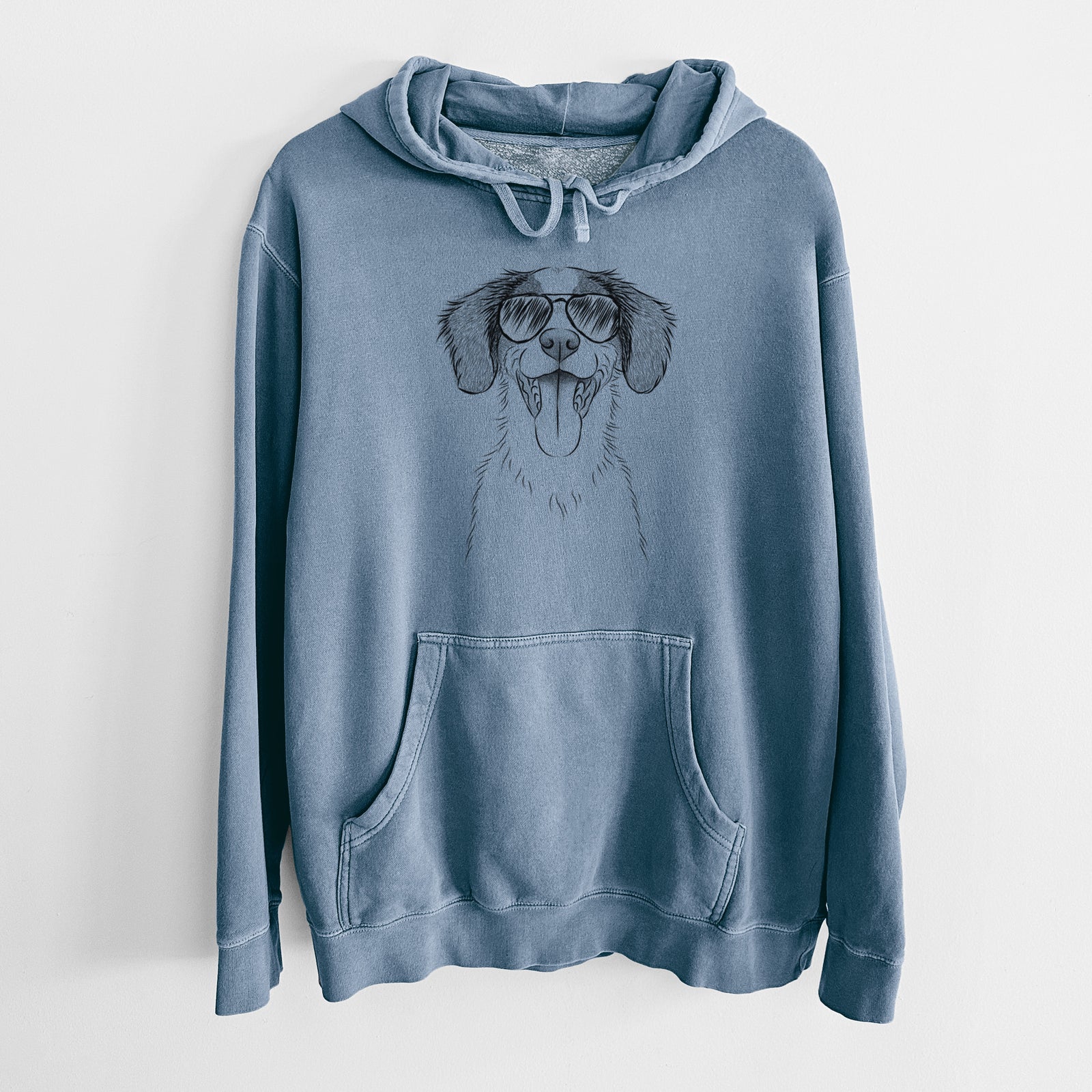 Hand-drawn sketch of Birdie the Brittany wearing aviator sunglasses on a Slate Blue Unisex pigment dyed hoodie