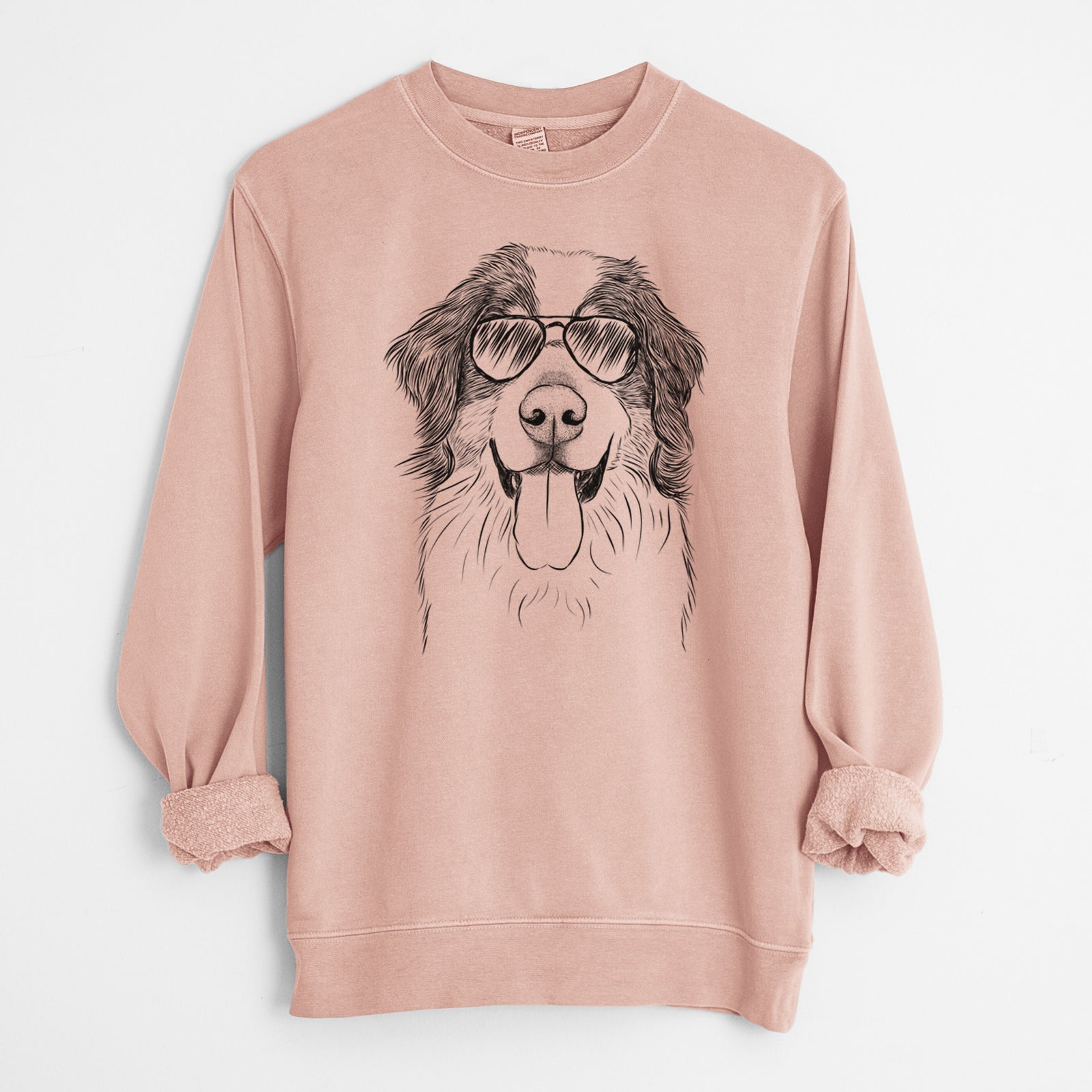 Hand-drawn sketch of Blaze the Bernese Mountain Dog wearing aviator sunglasses on a Dusty Pink Unisex pigment dyed crew sweatshirt