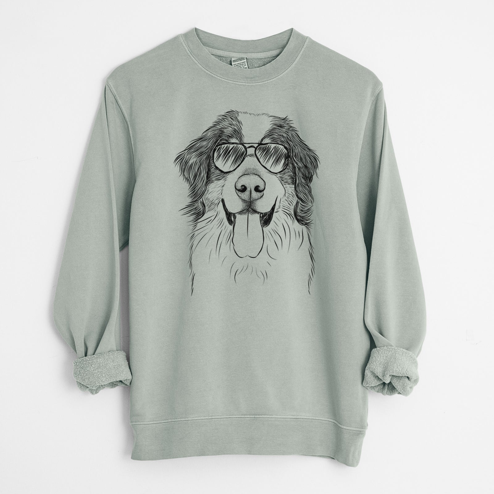 Hand-drawn sketch of Blaze the Bernese Mountain Dog wearing aviator sunglasses on a Sage Unisex pigment dyed crew sweatshirt