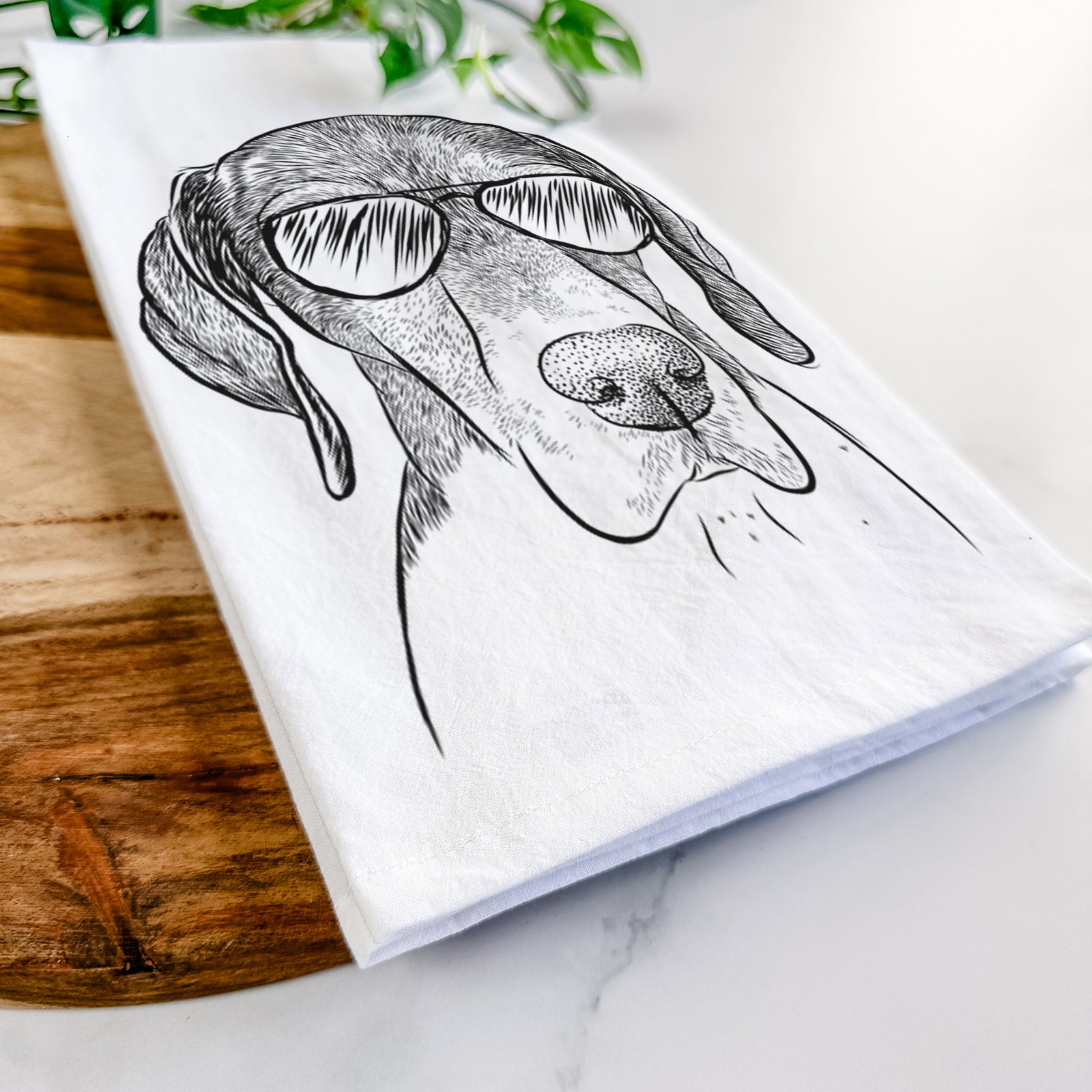 Hand-drawn sketch of Bohdi the German Shorthaired Pointer wearing aviator sunglasses on a tea towel