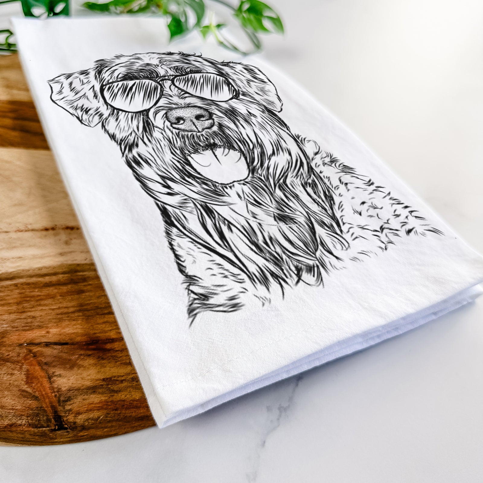 Hand-drawn sketch of Bonnie the Bouvier Des Flandres wearing aviator sunglasses on a tea towel