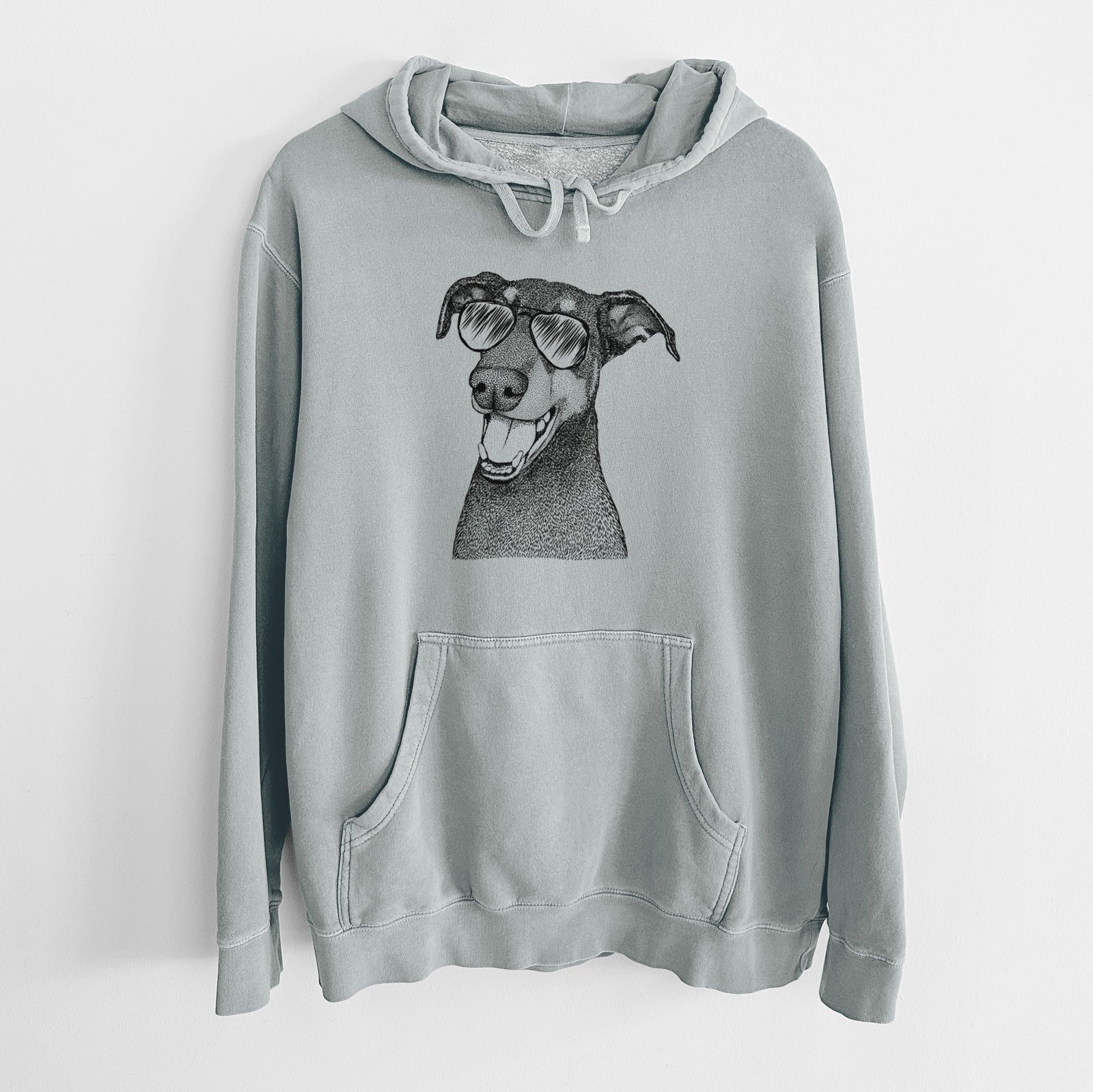 Hand-drawn sketch of Bunnie the Doberman Pinscher wearing aviator sunglasses on a Sage Unisex pigment dyed hoodie