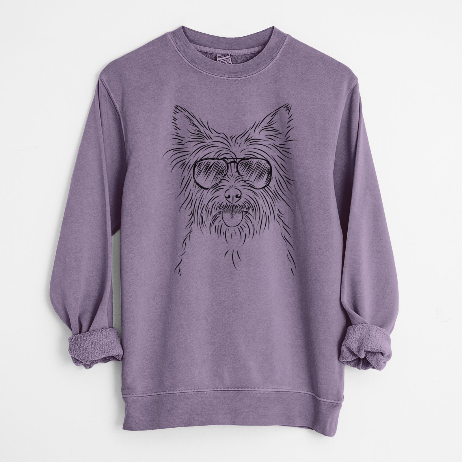 Hand-drawn sketch of Calum the Cairn Terrier wearing aviator sunglasses on a Plum Unisex pigment dyed crew sweatshirt