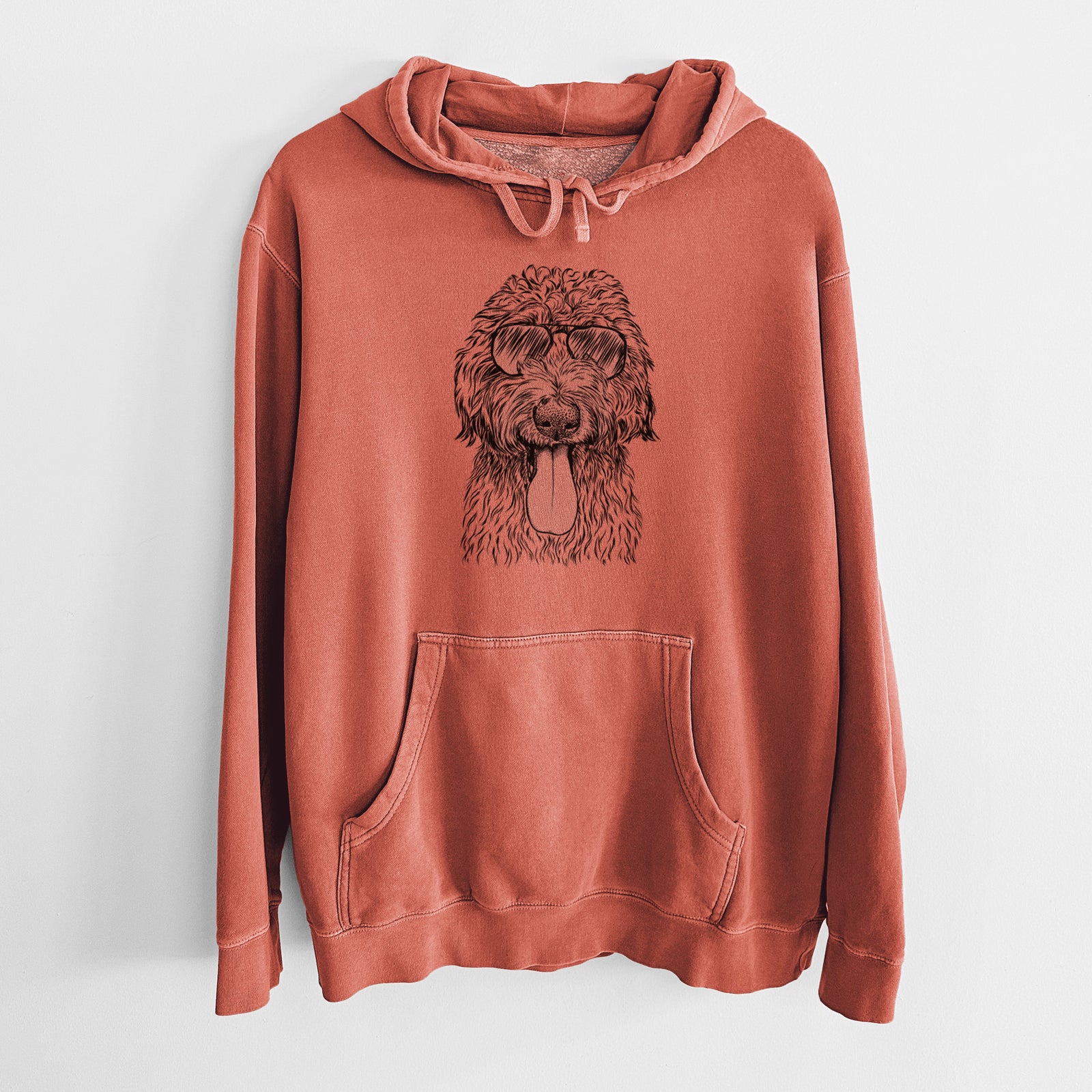Hand-drawn sketch of CiCi Paulk the Aussiedoodle wearing aviator sunglasses on an Amber Unisex pigment dyed hoodie