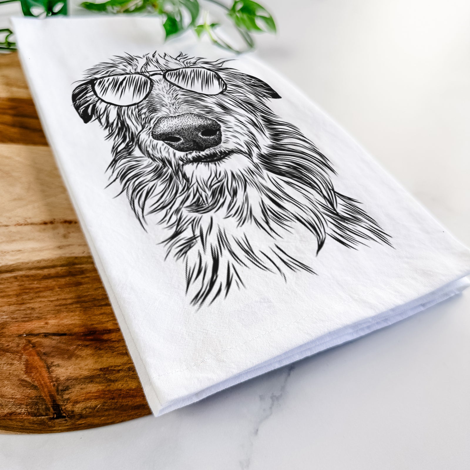 Hand-drawn sketch of Cleod the Scottish Deerhound wearing aviator sunglasses on a tea towel