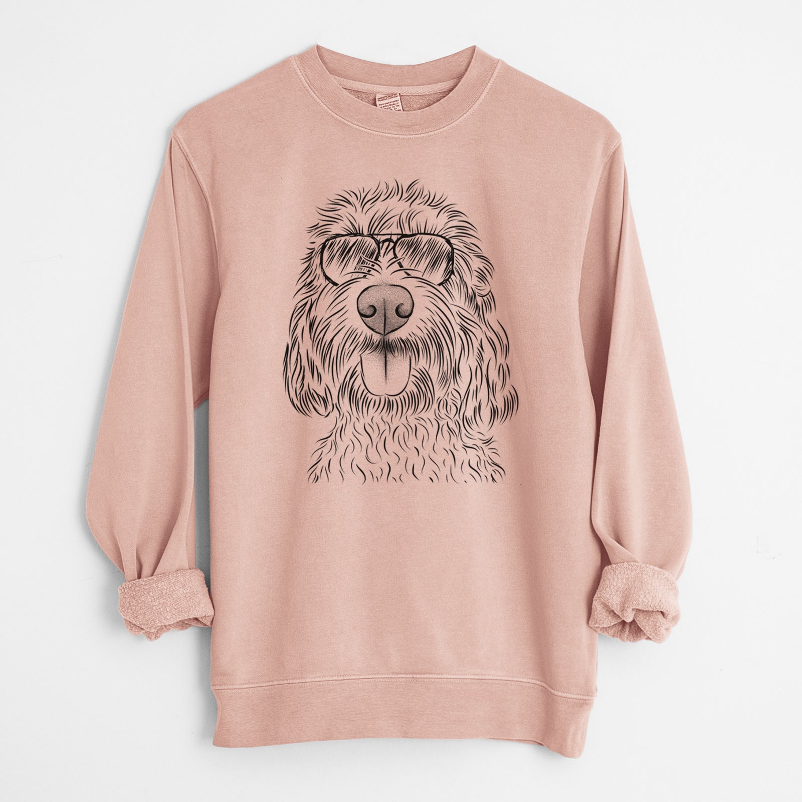 Hand-drawn sketch of Clover the Cockapoo wearing aviator sunglasses on a Dusty Pink Unisex pigment dyed crew sweatshirt
