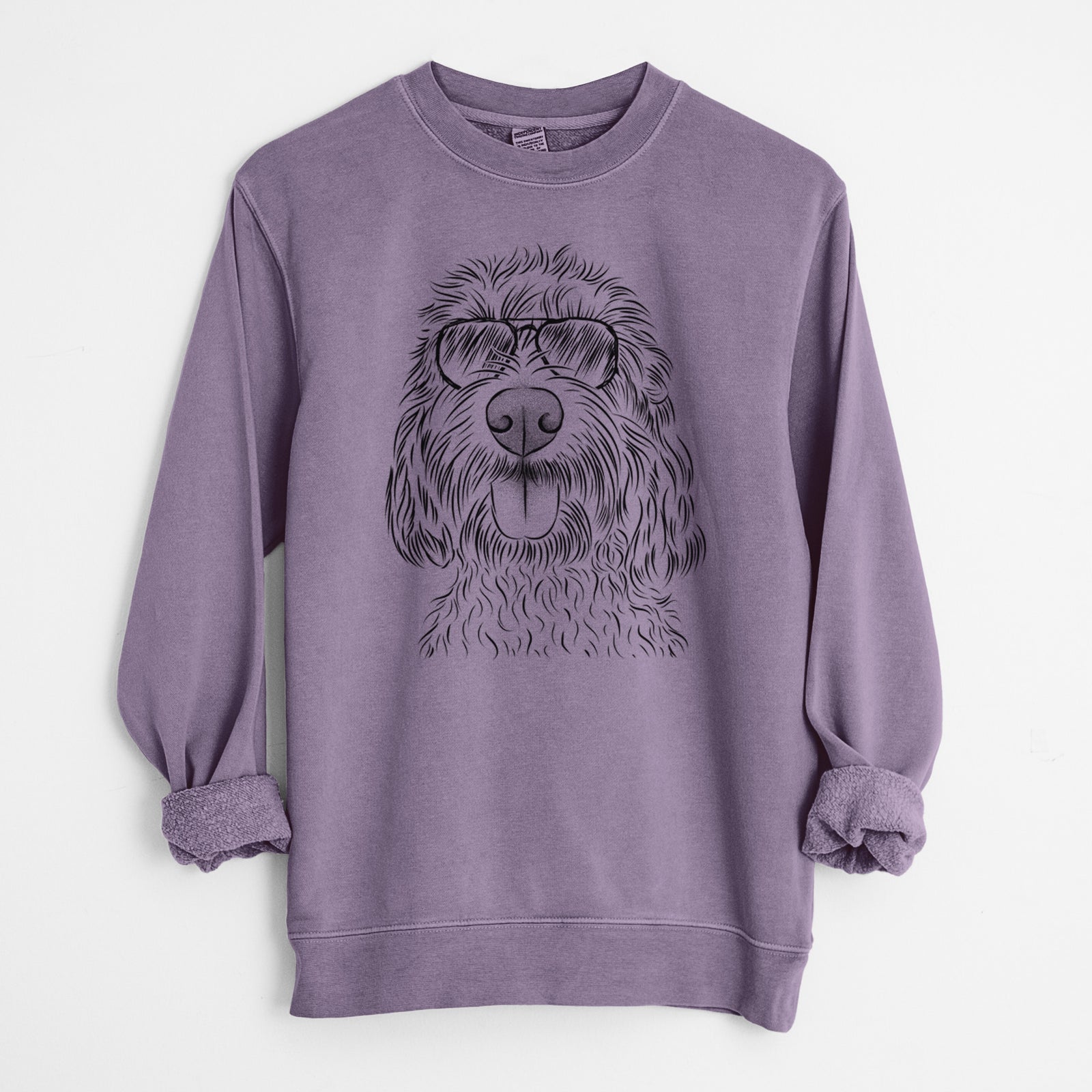 Hand-drawn sketch of Clover the Cockapoo wearing aviator sunglasses on a Plum Unisex pigment dyed crew sweatshirt