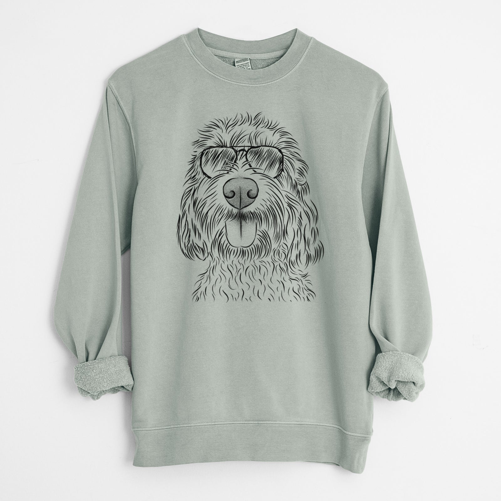 Hand-drawn sketch of Clover the Cockapoo wearing aviator sunglasses on a Sage Unisex pigment dyed crew sweatshirt