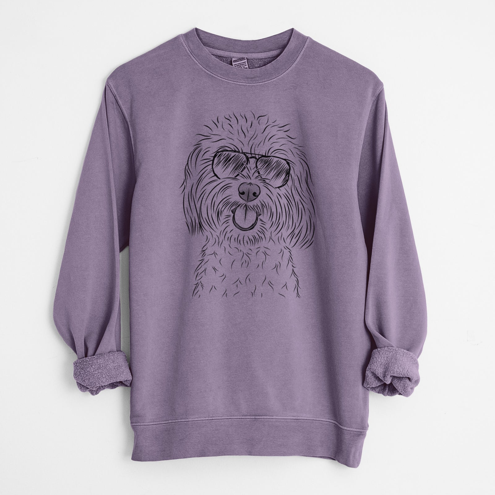 Hand-drawn sketch of Cuddles the Coton de Tulear wearing aviator sunglasses on a Plum Unisex pigment dyed crew sweatshirt