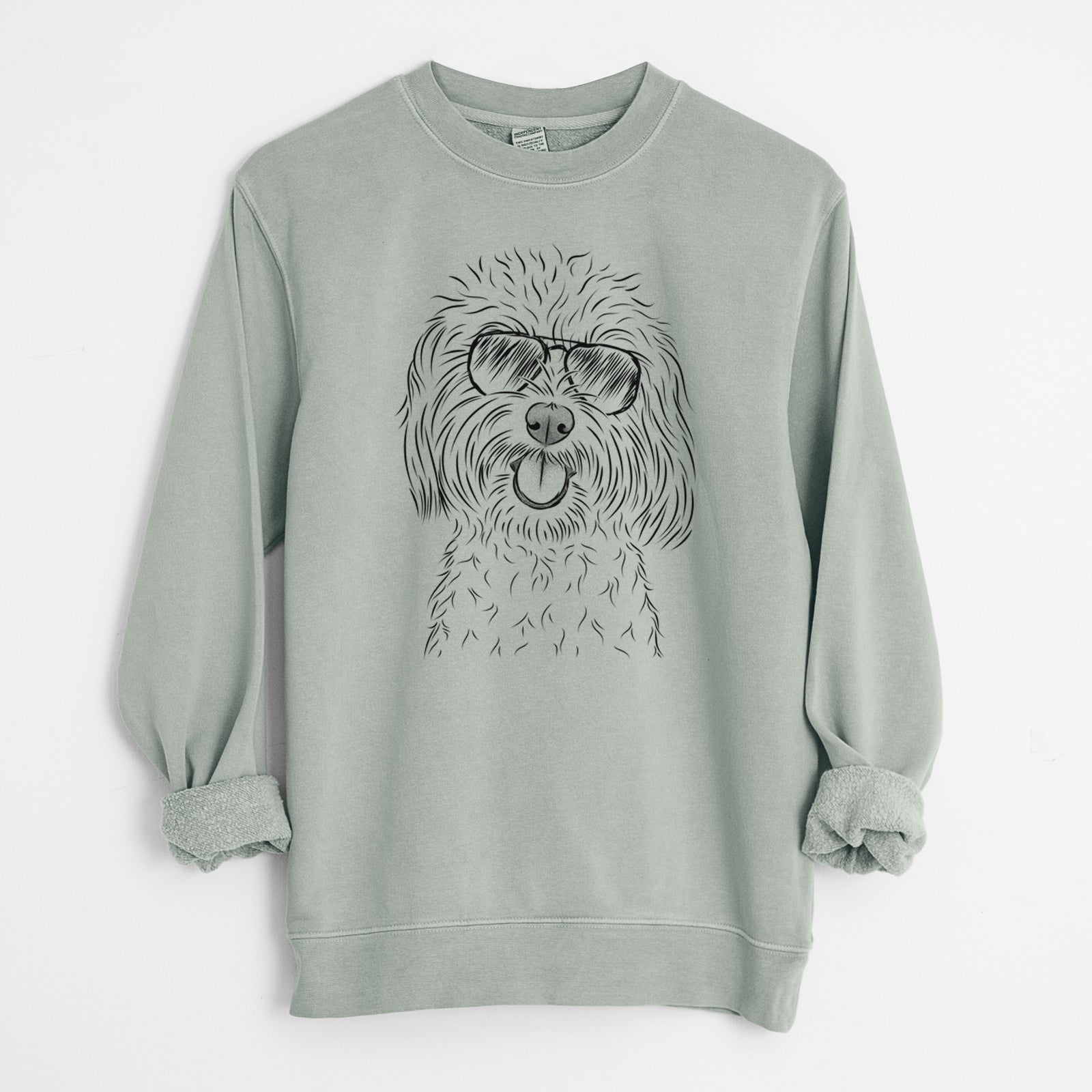 Hand-drawn sketch of Cuddles the Coton de Tulear wearing aviator sunglasses on a Sage Unisex pigment dyed crew sweatshirt