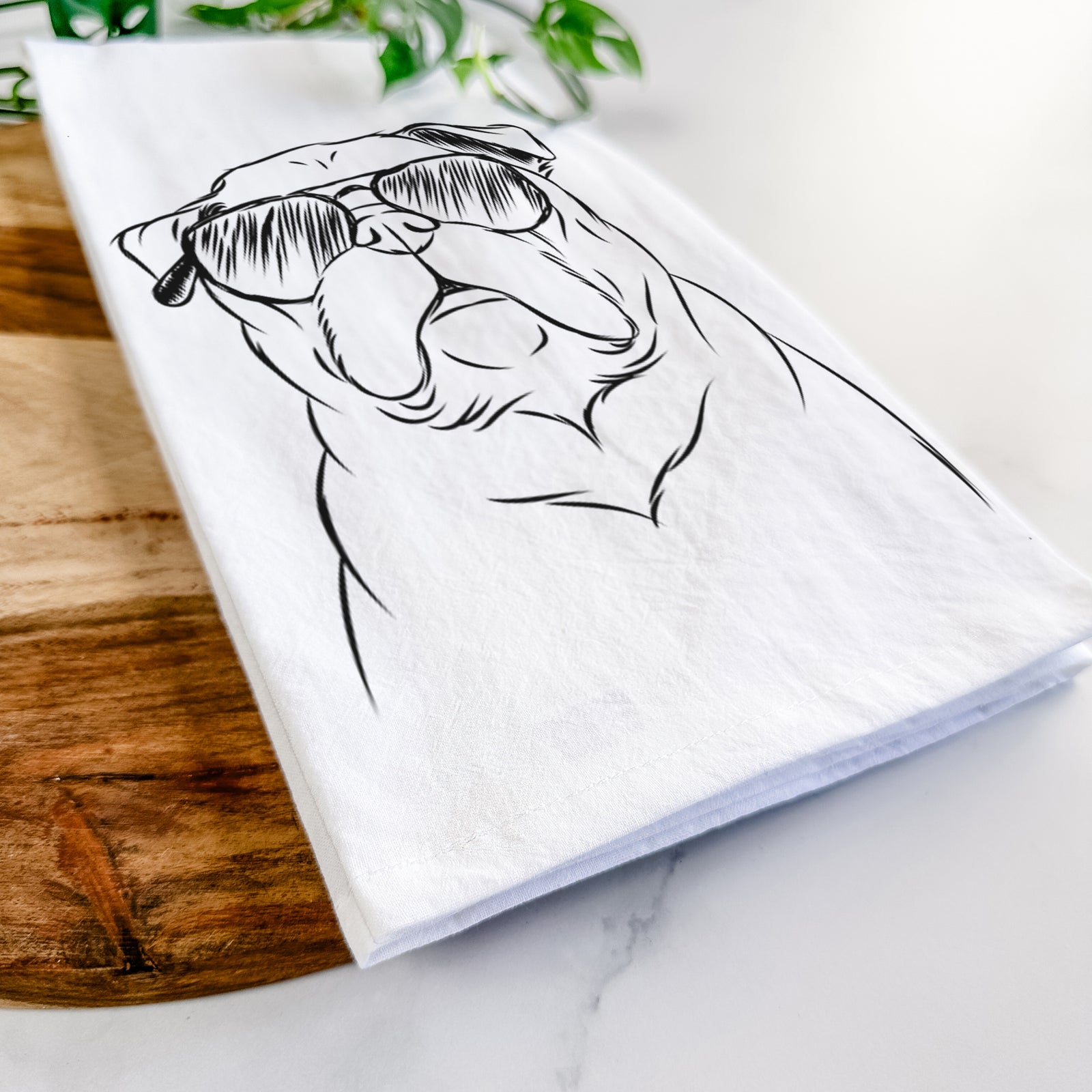 Hand-drawn sketch of Darling Chloe the Pug wearing aviator sunglasses on a tea towel