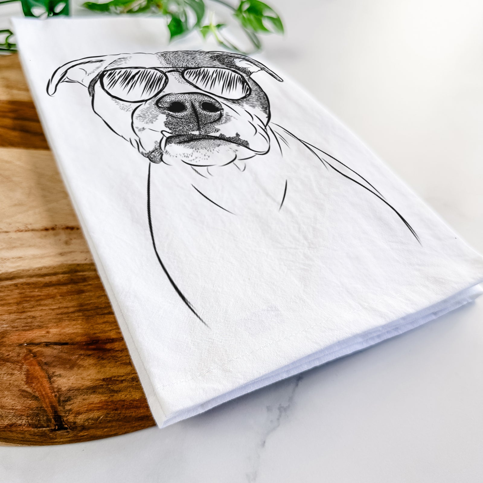 Hand-drawn sketch of Dexter the Pitbull wearing aviator sunglasses on a tea towel