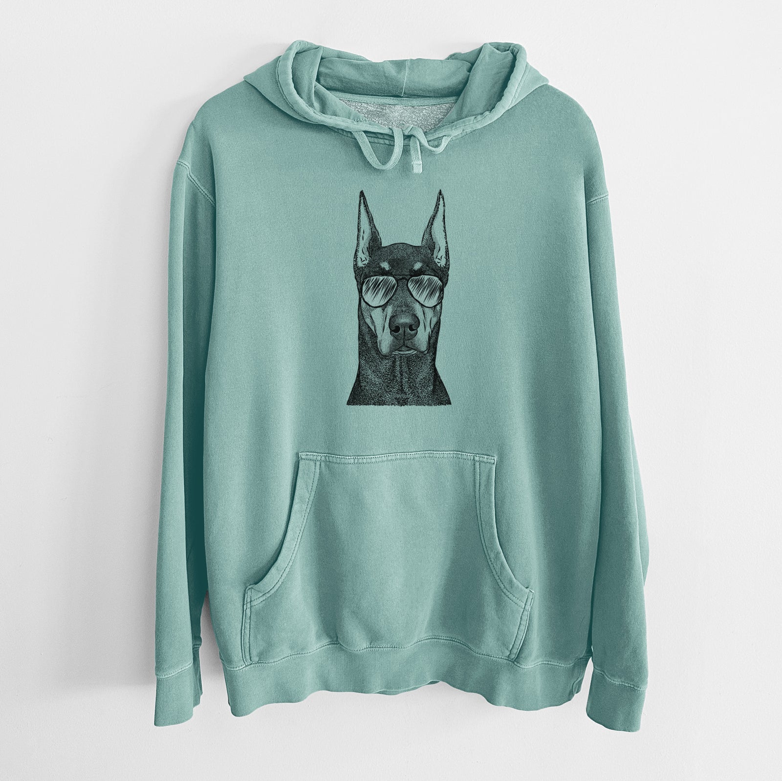 Hand-drawn sketch of Drake the Doberman Pinscher wearing aviator sunglasses on a Mint Unisex pigment dyed hoodie