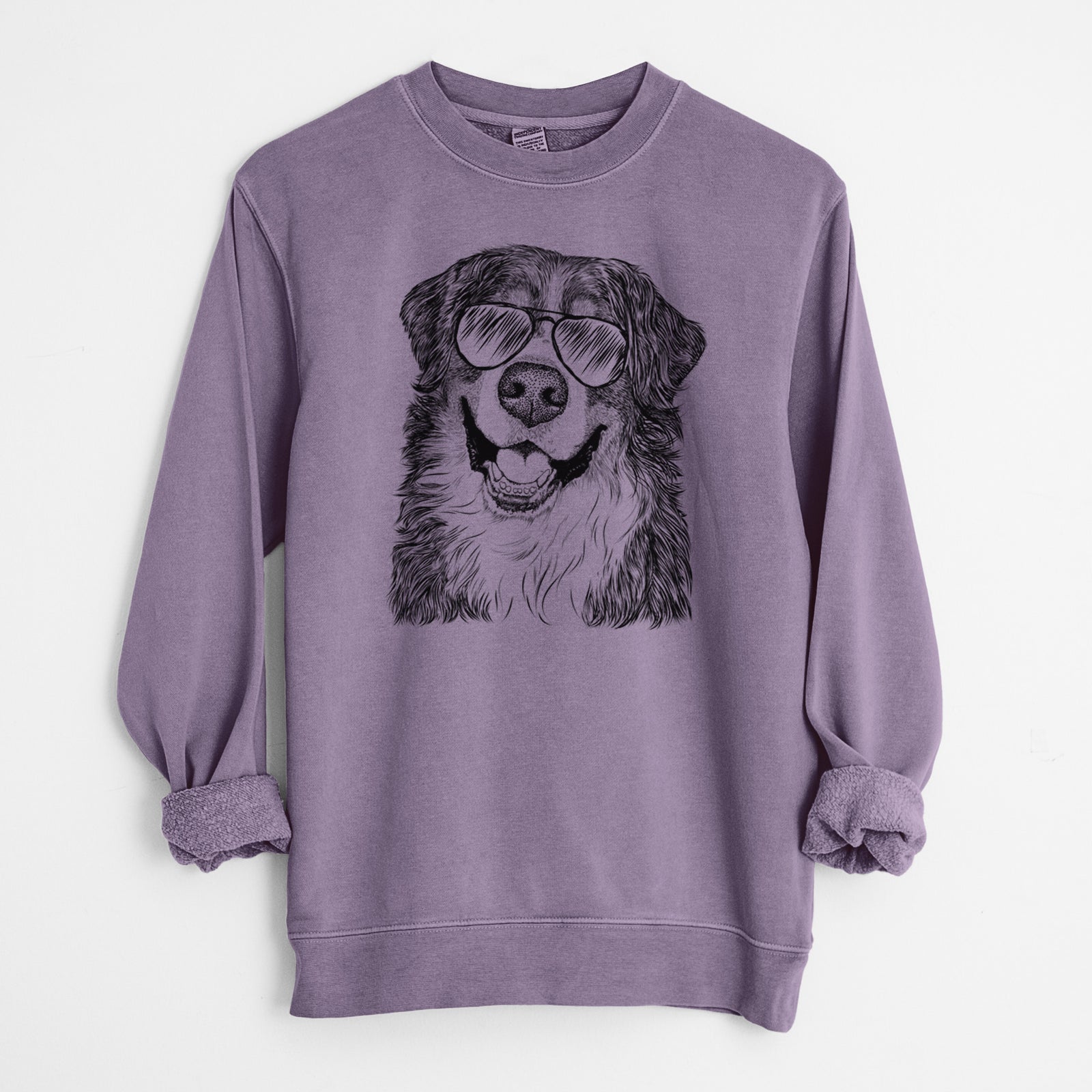 Hand-drawn sketch of Eiger the Bernese Mountain Dog wearing aviator sunglasses on a Plum Unisex pigment dyed crew sweatshirt