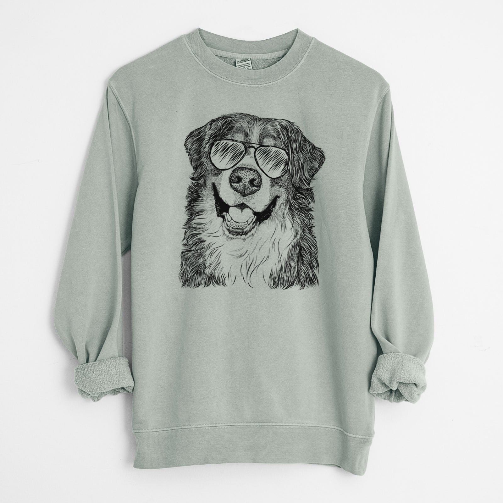 Hand-drawn sketch of Eiger the Bernese Mountain Dog wearing aviator sunglasses on a Sage Unisex pigment dyed crew sweatshirt