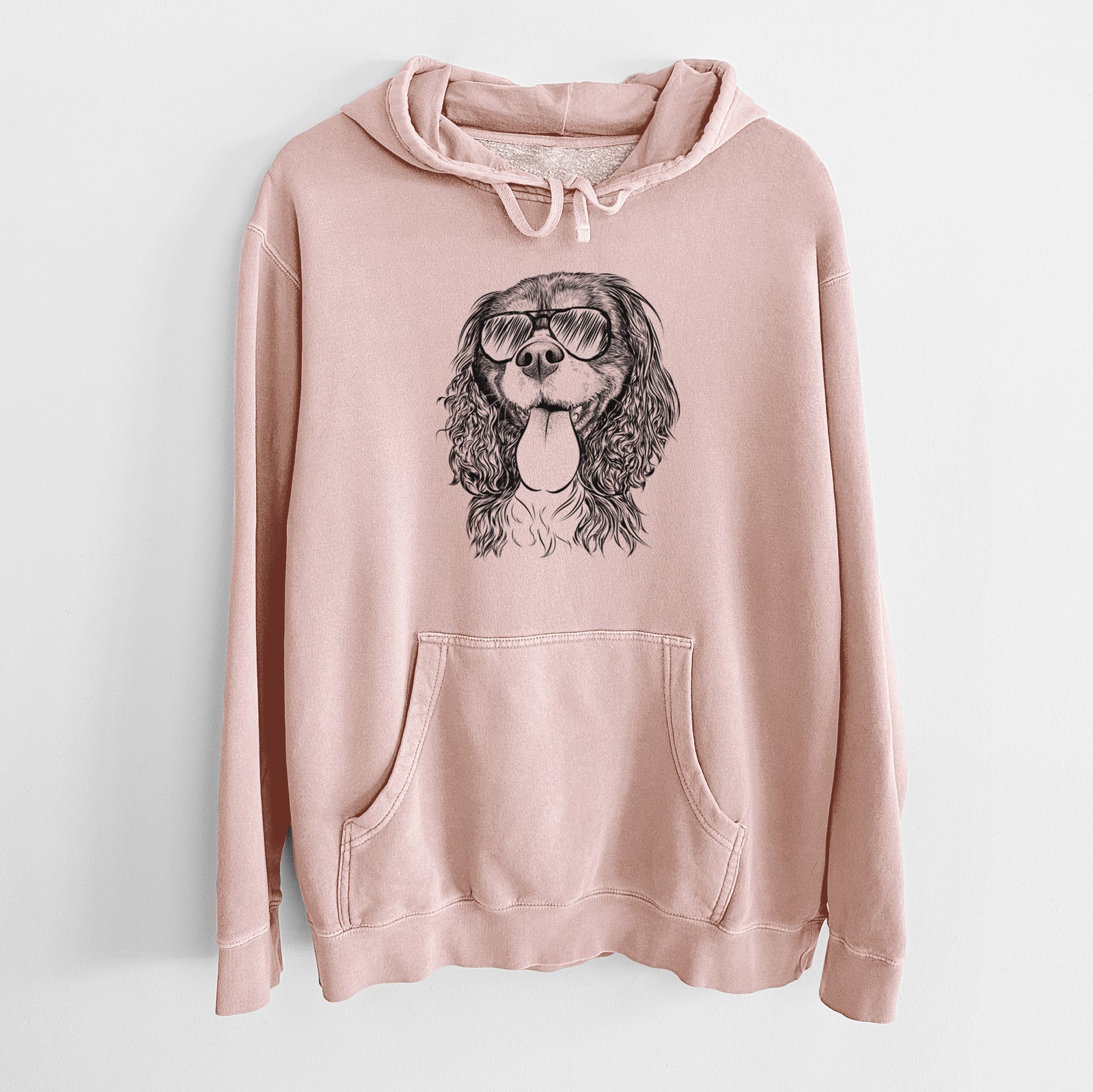 Hand-drawn sketch of Elizabeth the Cavalier King Charles Spaniel wearing aviator sunglasses on a Dusty Pink Unisex pigment dyed hoodie