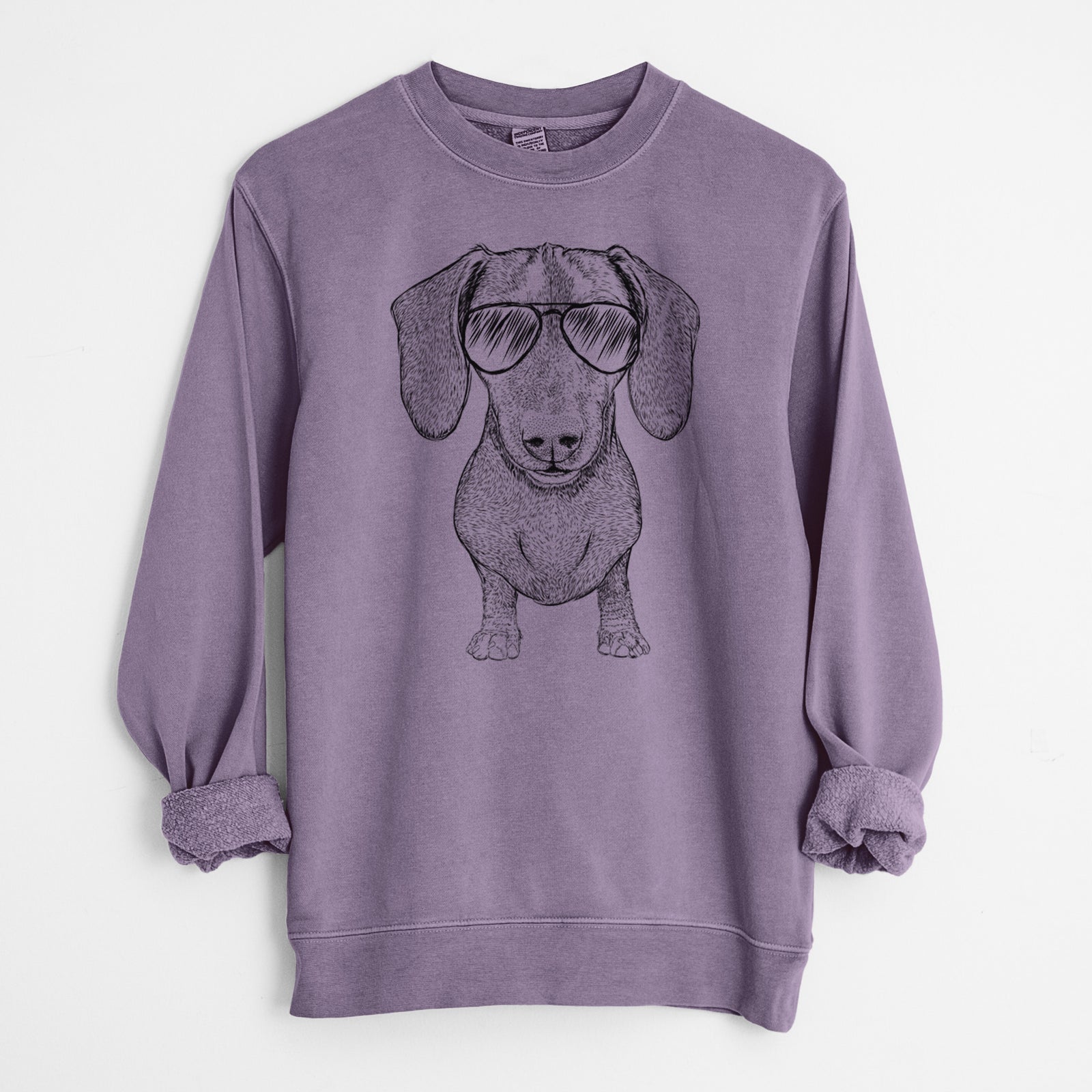 Hand-drawn sketch of Ernie the Mini Dachshund wearing aviator sunglasses on a Plum Unisex pigment dyed crew sweatshirt