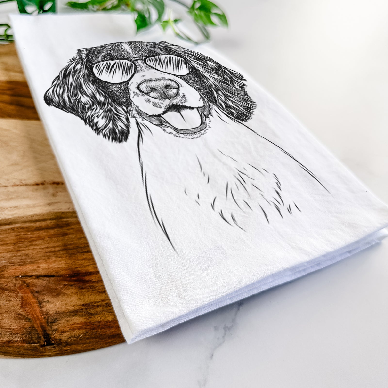 Hand-drawn sketch of Ever the English Springer Spaniel wearing aviator sunglasses on a tea towel