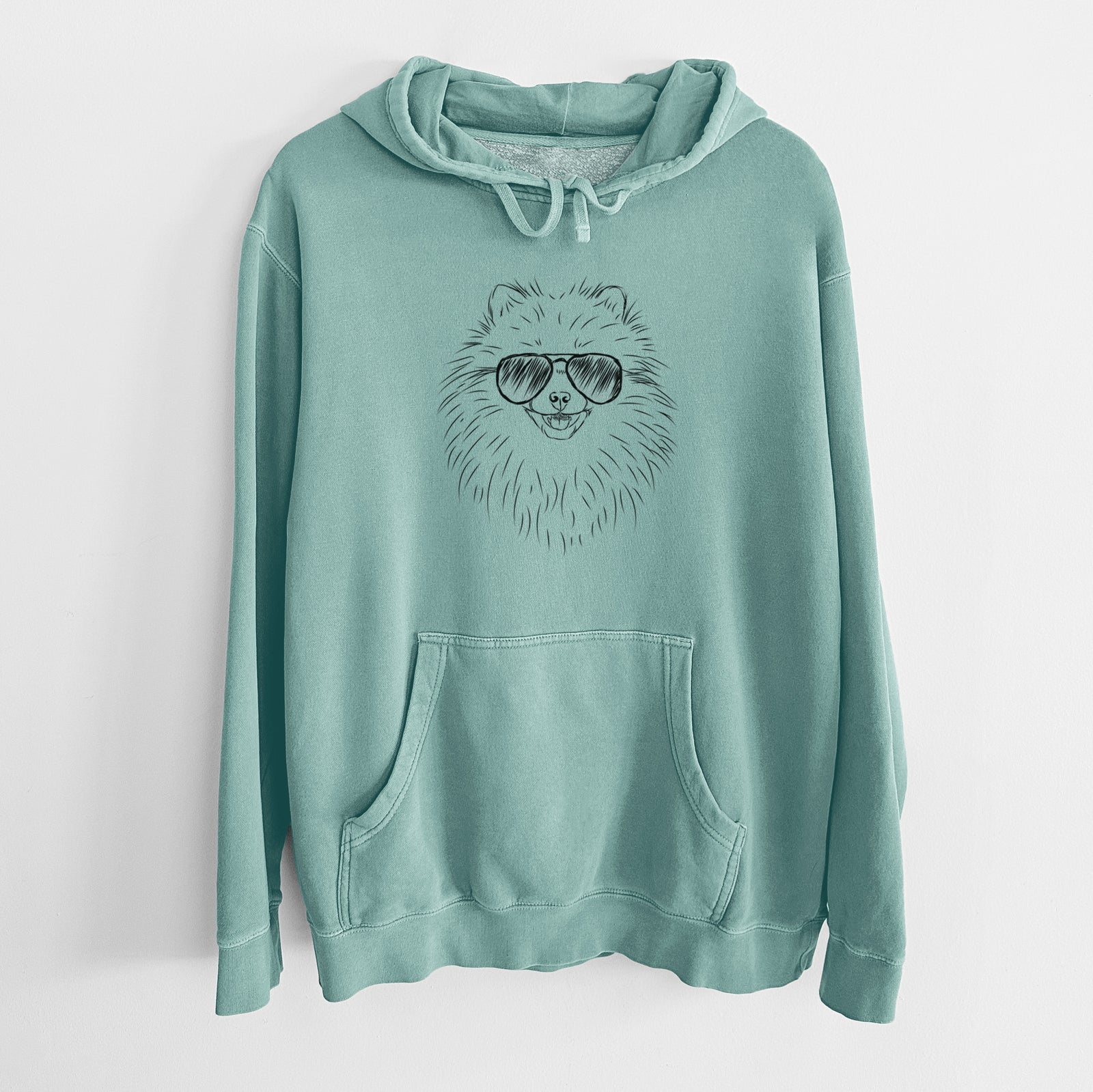 Hand-drawn sketch of Finn the Pomeranian wearing aviator sunglasses on a Mint Unisex pigment dyed hoodie