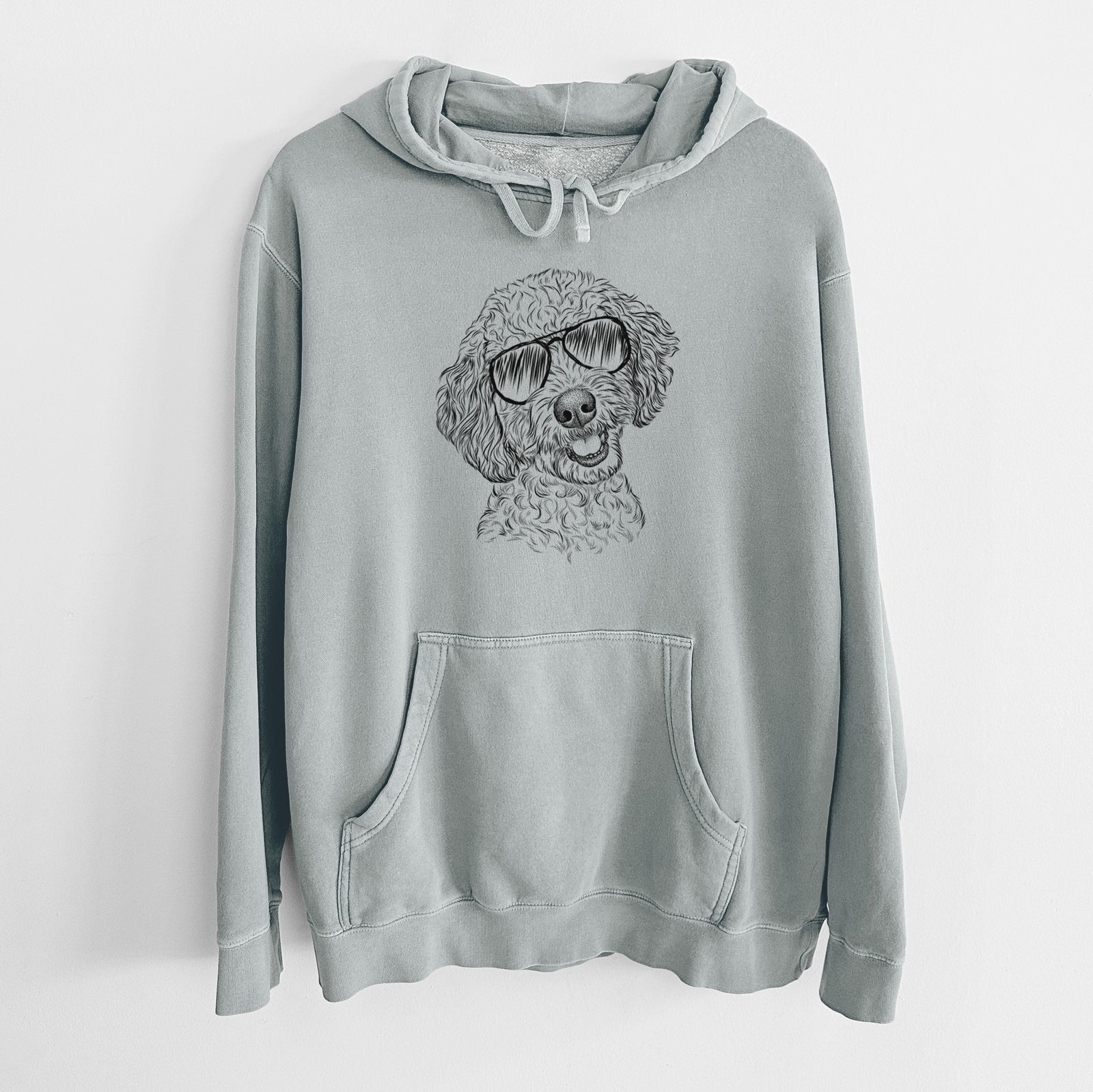 Hand-drawn sketch of Gizmo the Goldendoodle wearing aviator sunglasses on a Sage Unisex pigment dyed hoodie