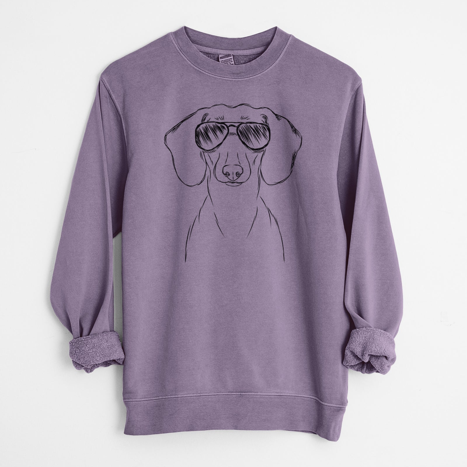 Hand-drawn sketch of Hans the Dachshund wearing aviator sunglasses on a Plum Unisex pigment dyed crew sweatshirt
