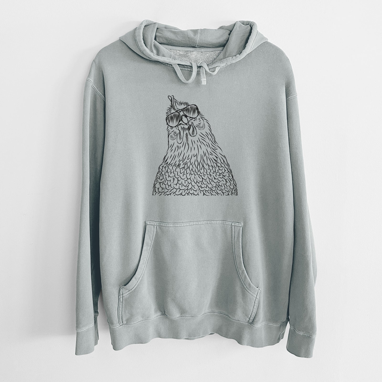 Hand-drawn sketch of Henrietta the Chicken wearing aviator sunglasses on a Sage Unisex pigment dyed hoodie