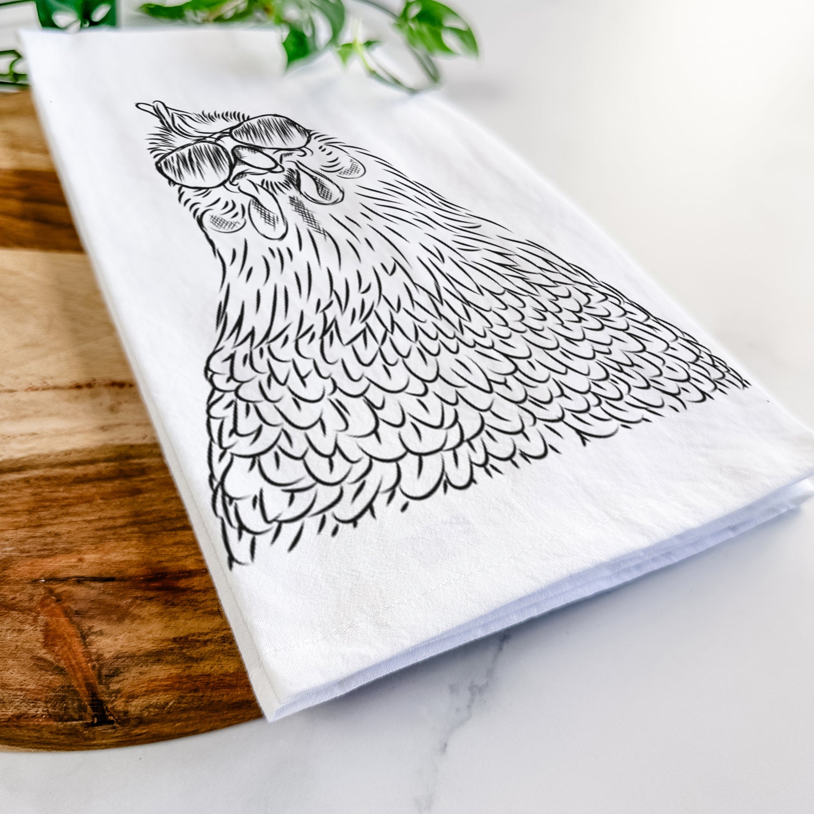 Hand-drawn sketch of Henrietta the Chicken wearing aviator sunglasses on a tea towel