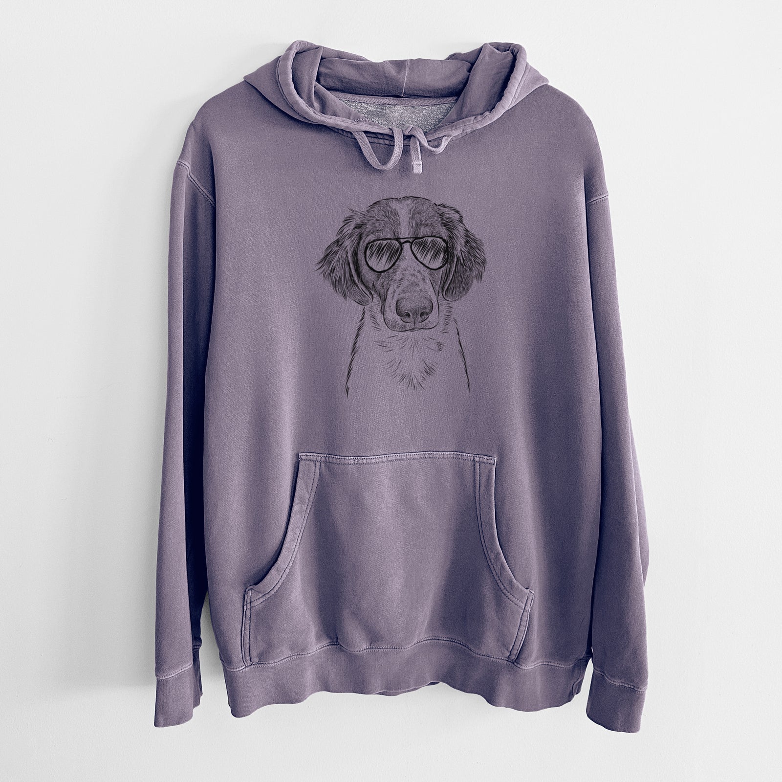 Hand-drawn sketch of Holly the Brittany Spaniel wearing aviator sunglasses on a Plum Unisex pigment dyed hoodie
