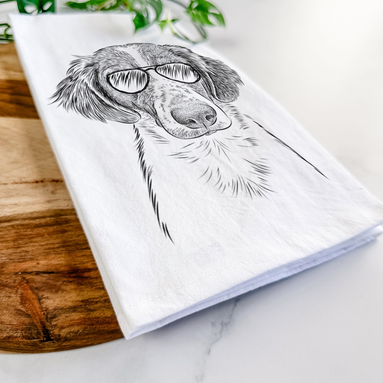 Hand-drawn sketch of Holly the Brittany Spaniel wearing aviator sunglasses on a tea towel