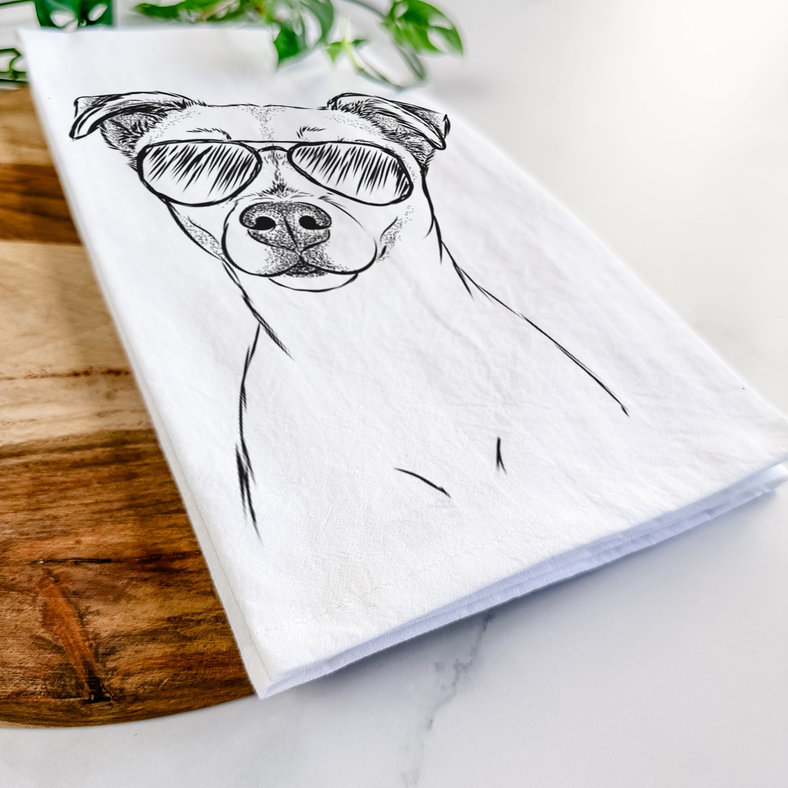 Hand-drawn sketch of Izzy the Chiweenie wearing aviator sunglasses on a tea towel