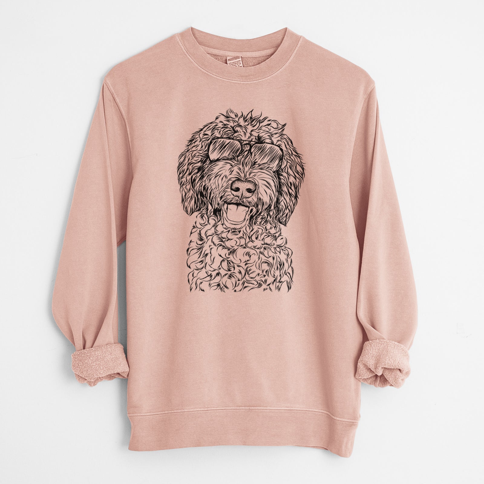 Hand-drawn sketch of Jack the Chocolate Labradoodle wearing aviator sunglasses on a Dusty Pink Unisex pigment dyed crew sweatshirt