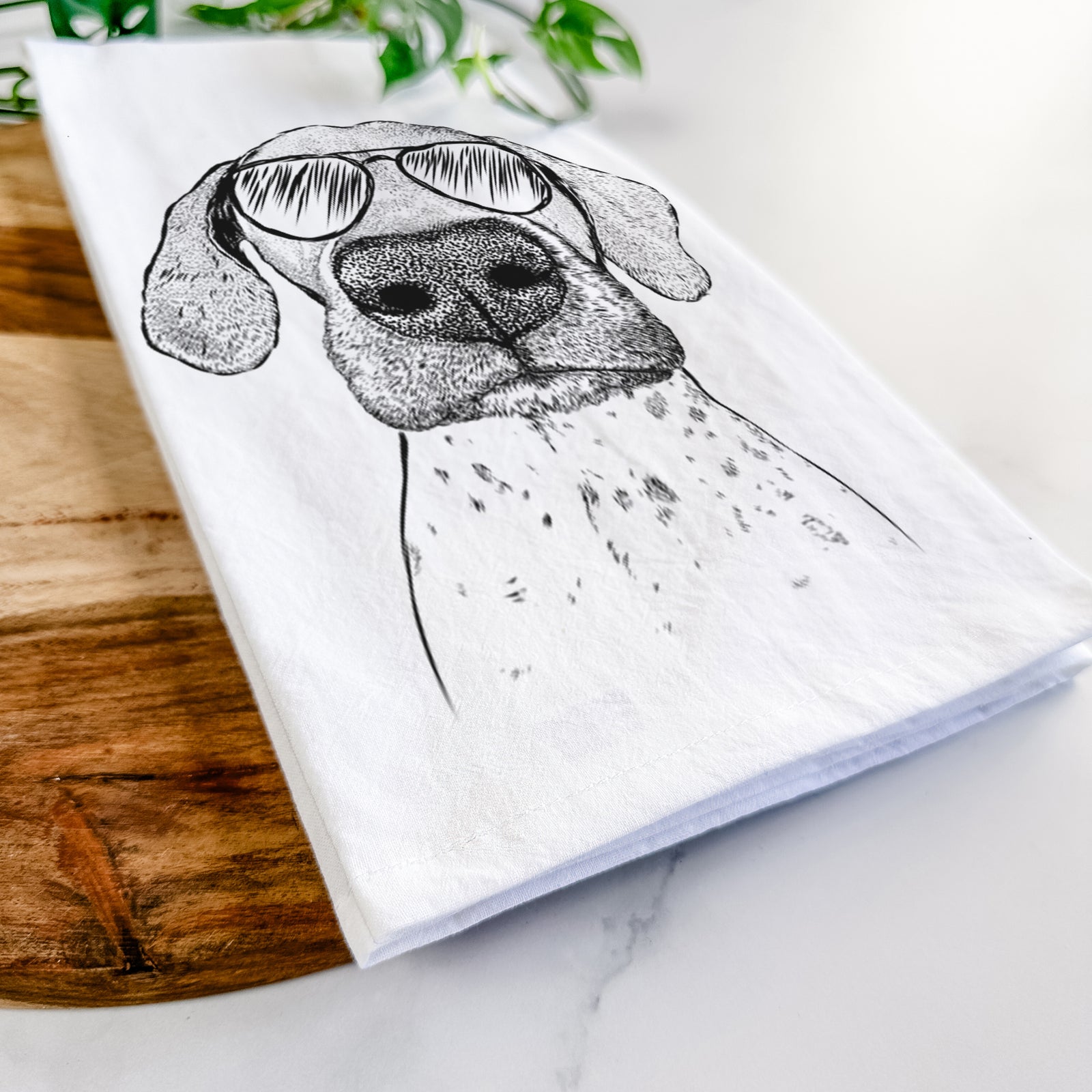 Hand-drawn sketch of Leroy the German Shorthaired Pointer wearing aviator sunglasses on a tea towel