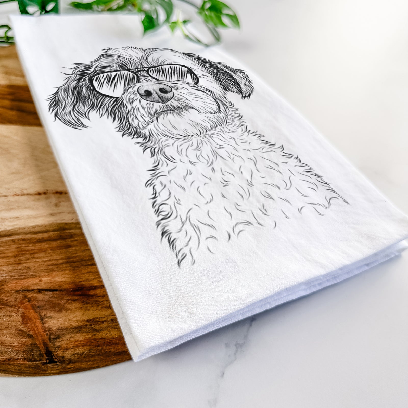 Hand-drawn sketch of Louise the Havanese wearing aviator sunglasses on a tea towel