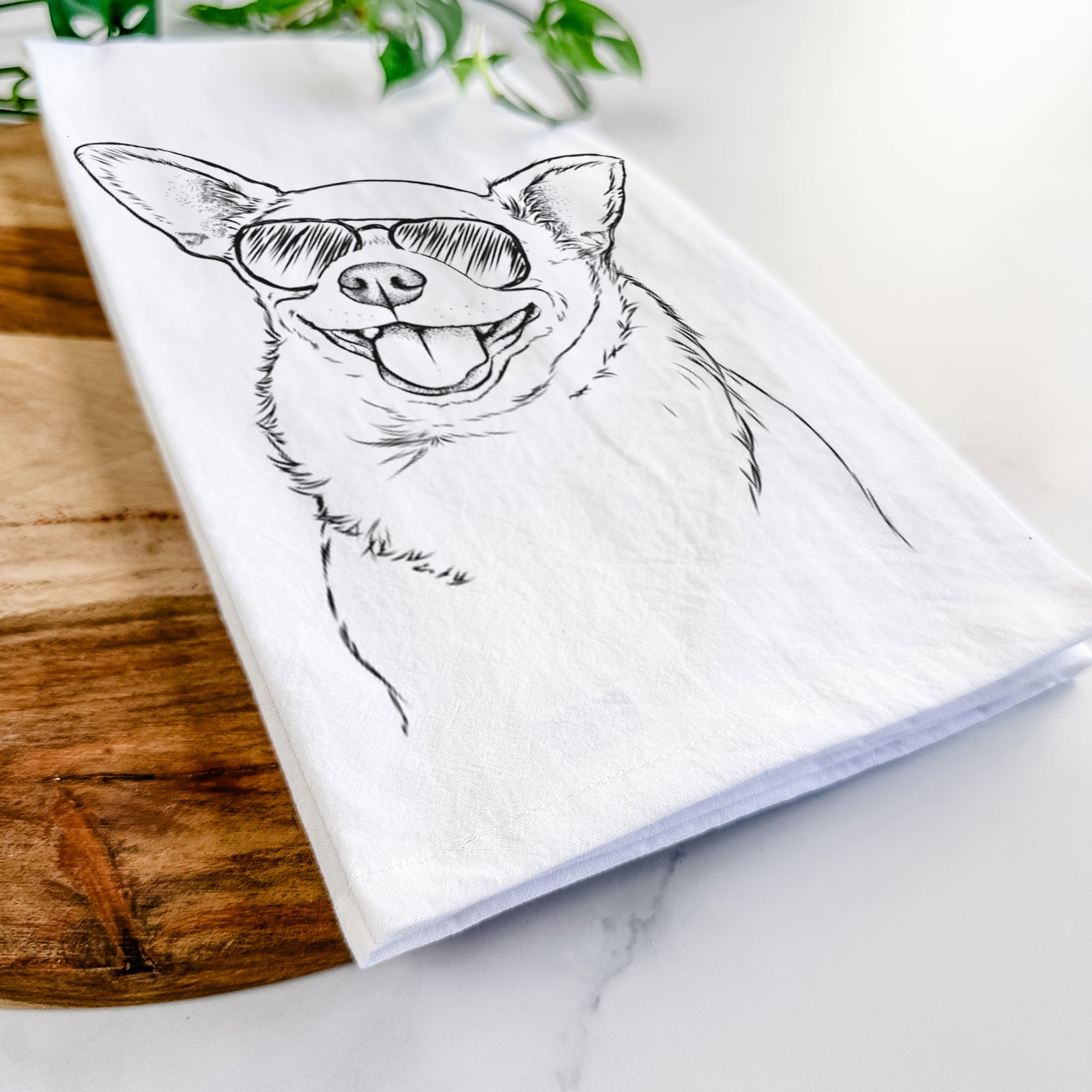 Hand-drawn sketch of Maddison Pearl the Chihuahua wearing aviator sunglasses on a tea towel
