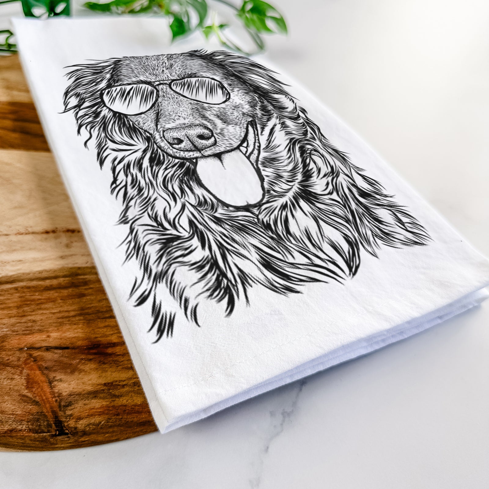Hand-drawn sketch of Maisie Mae the Aussiedor wearing aviator sunglasses on a tea towel