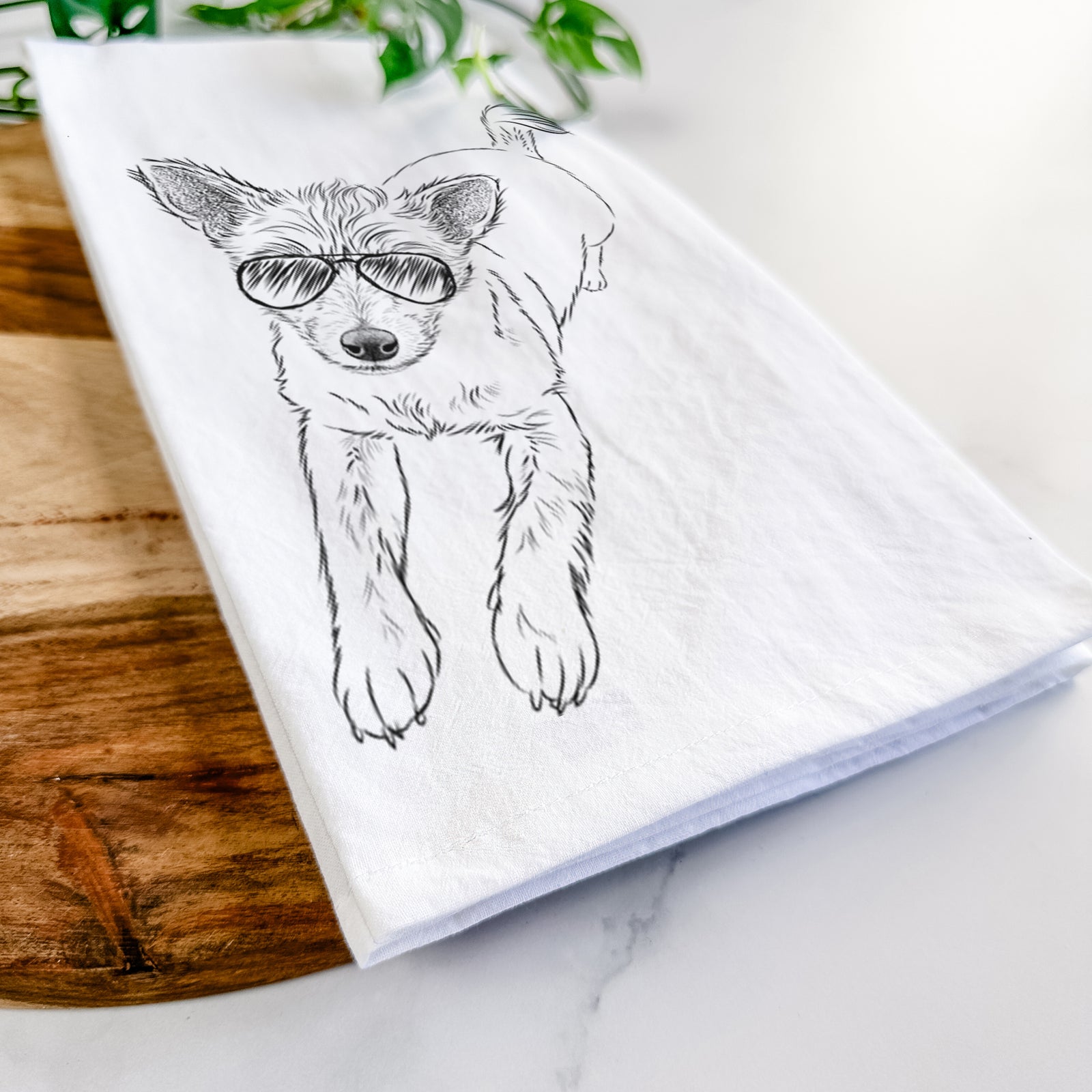 Hand-drawn sketch of Maisie the Terrier Mix wearing aviator sunglasses on a tea towel