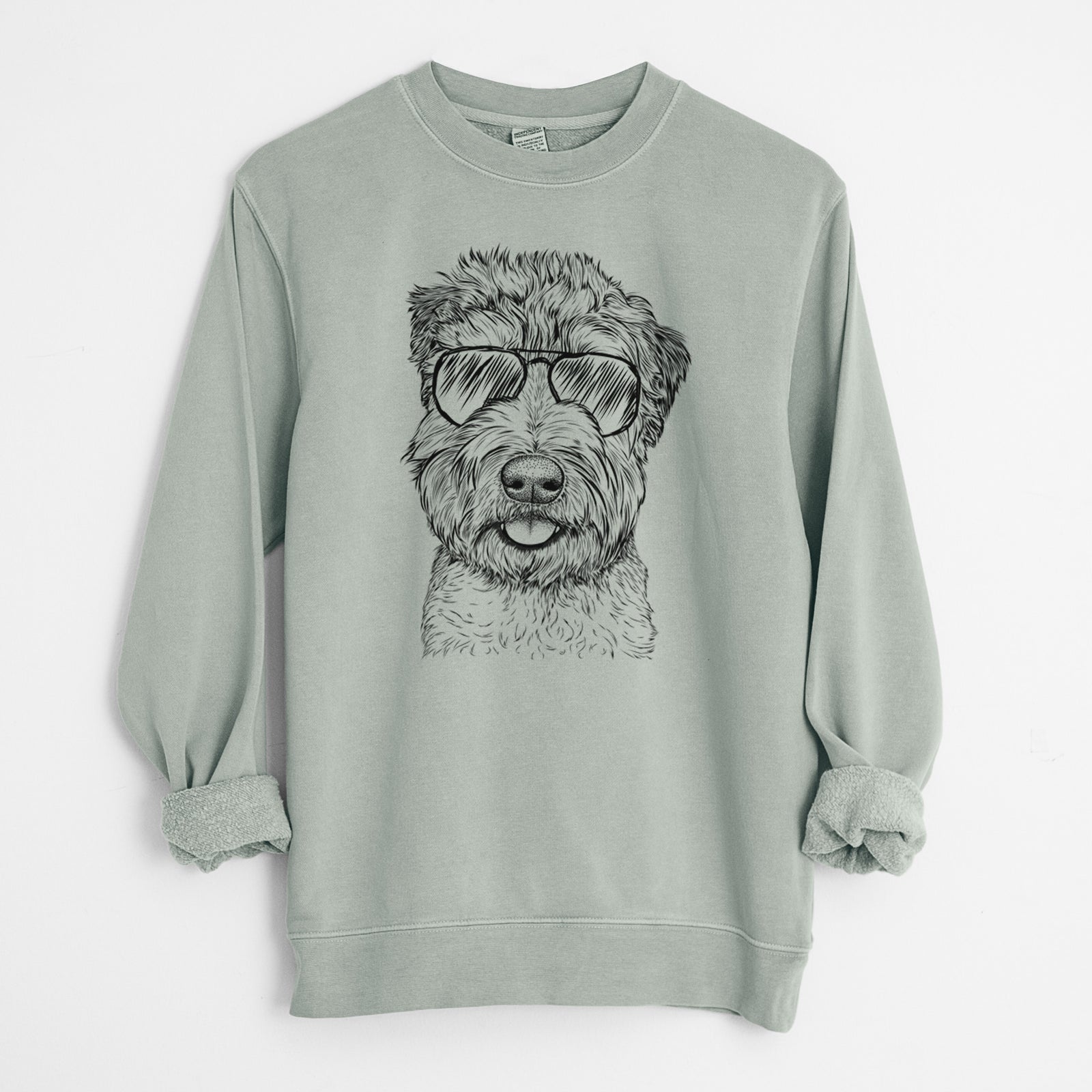 Hand-drawn sketch of Milton the Soft Coated Wheaten Terrier wearing aviator sunglasses on a Sage Unisex pigment dyed crew sweatshirt