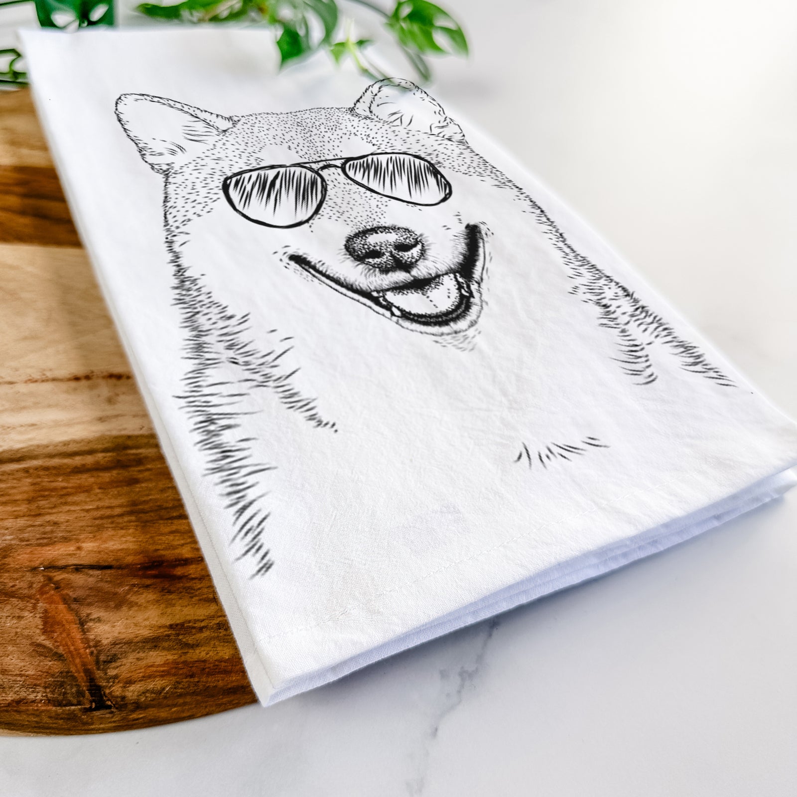 Hand-drawn sketch of Mitsu the Shiba Inu wearing aviator sunglasses on a tea towel
